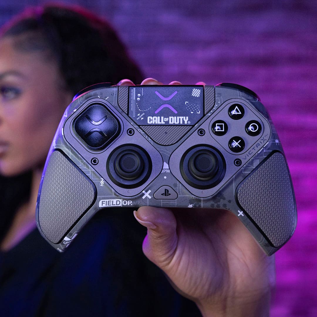 "Call of Duty" is a video game franchise, and "Field Op" is a type of game controller. The image shows a person holding a "Call of Duty" video game controller, specifically a "Field Op" controller.