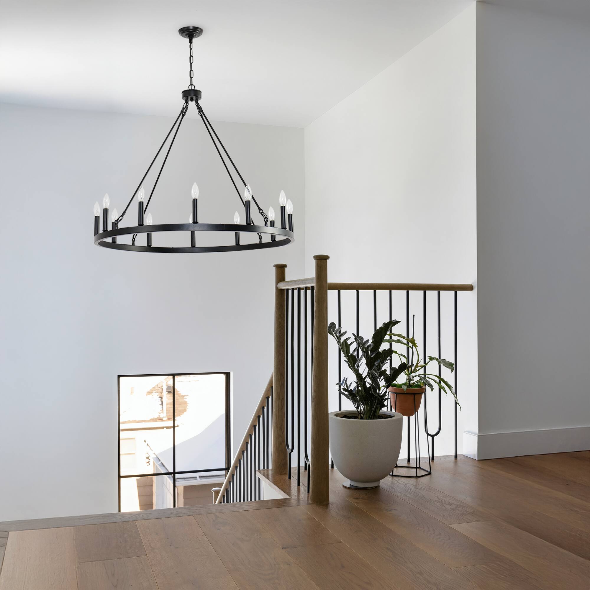 Left. RYHNUYNE - Wagon Wheel Chandelier 12 Light 31" Black Farmhouse Chandelier for Dining Room Rustic Country Pendant Light Fixtures - Black.