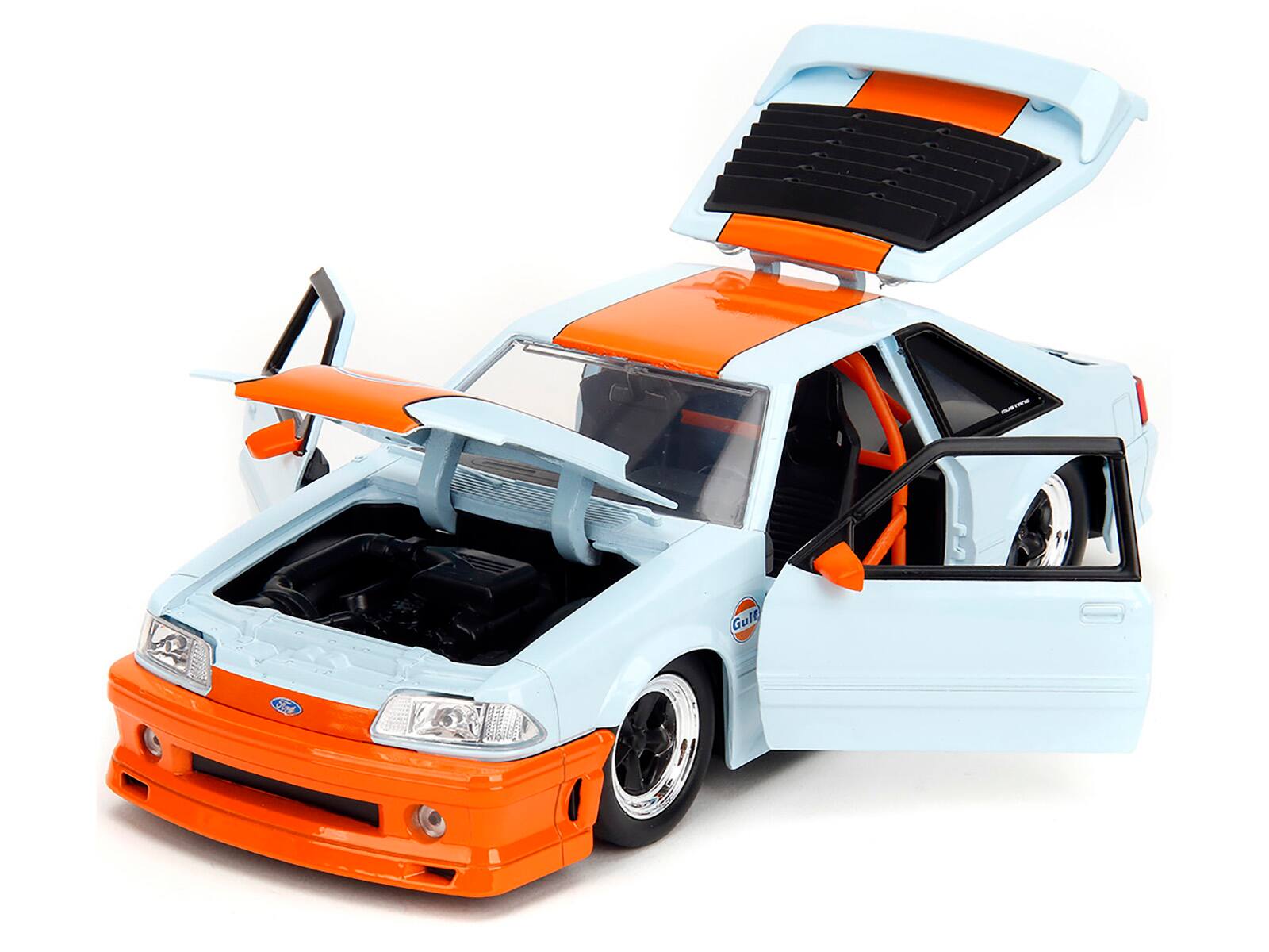 Angle. Jada - 1989 Ford Mustang GT "Gulf Oil" Light Blue with Orange Stripe "Bigtime Muscle" Series 1/24 Diecast Model Car by Jada - Light Blue And Orange Stripe.