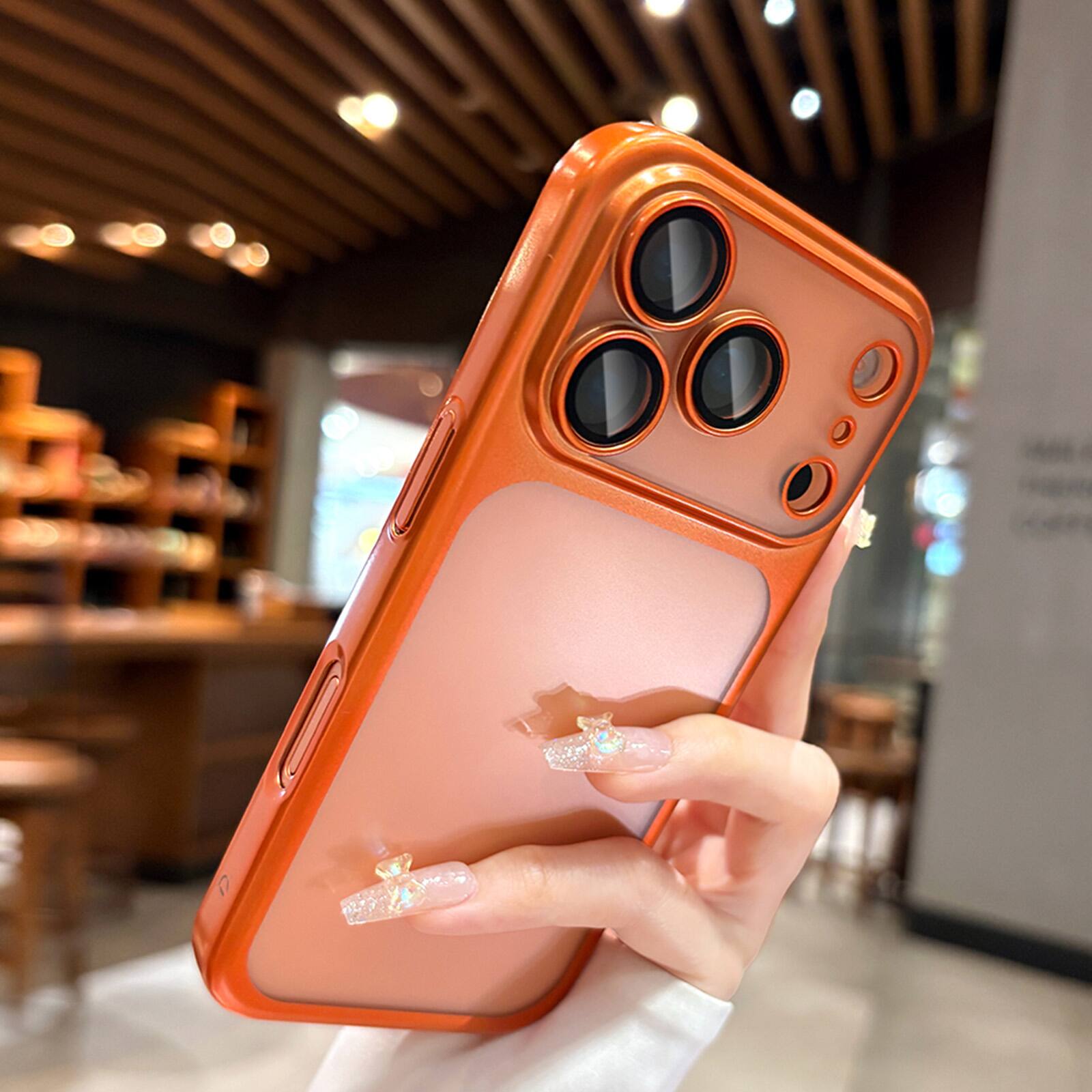 Angle. Dteck - Electroplated Ultra-Slim Shockproof Phone Case for iPhone 17 Pro Max, Matte Semi-Transparent Full Camera Protection - Orange.