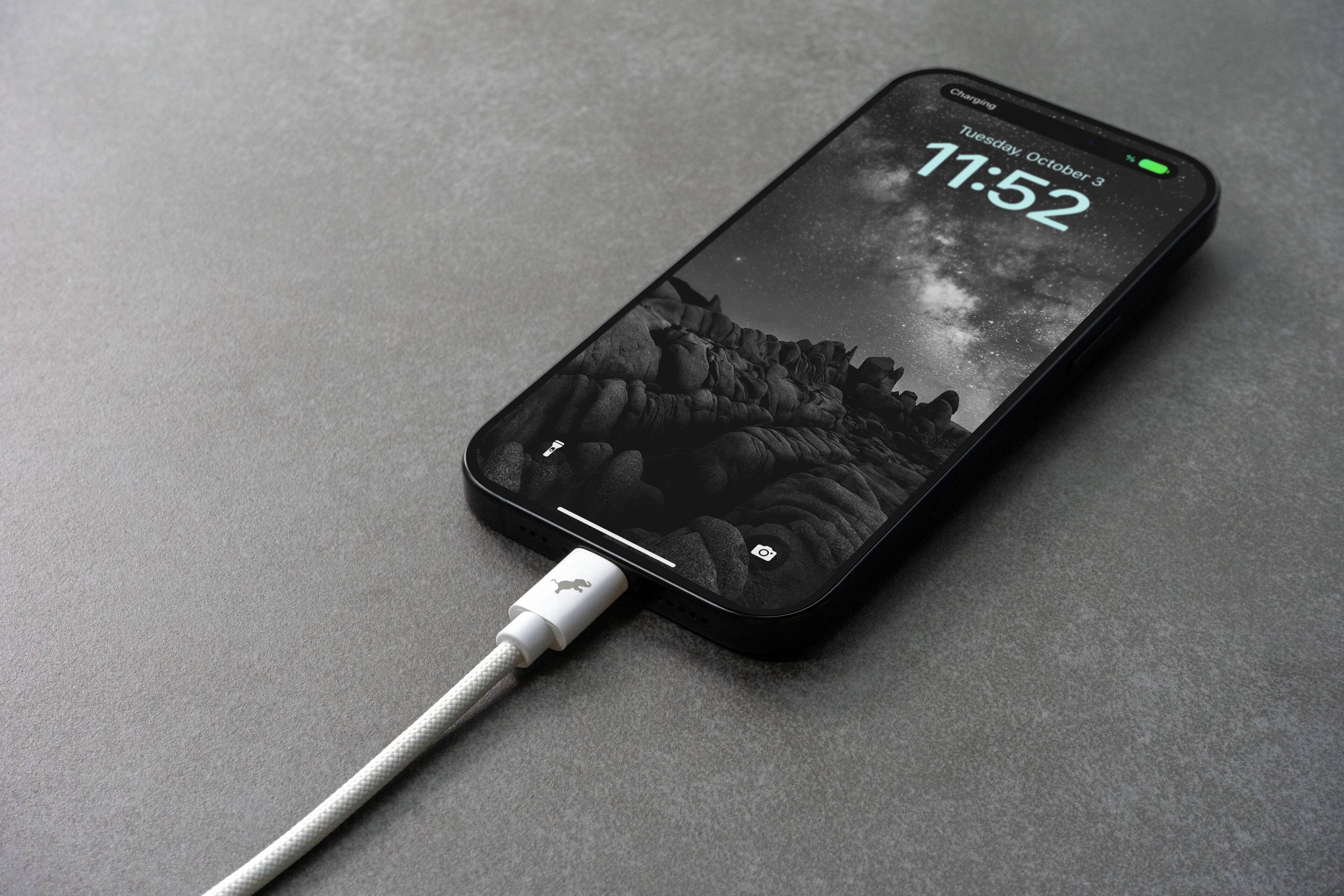 Charging Tuesday, October 3, 11:52.