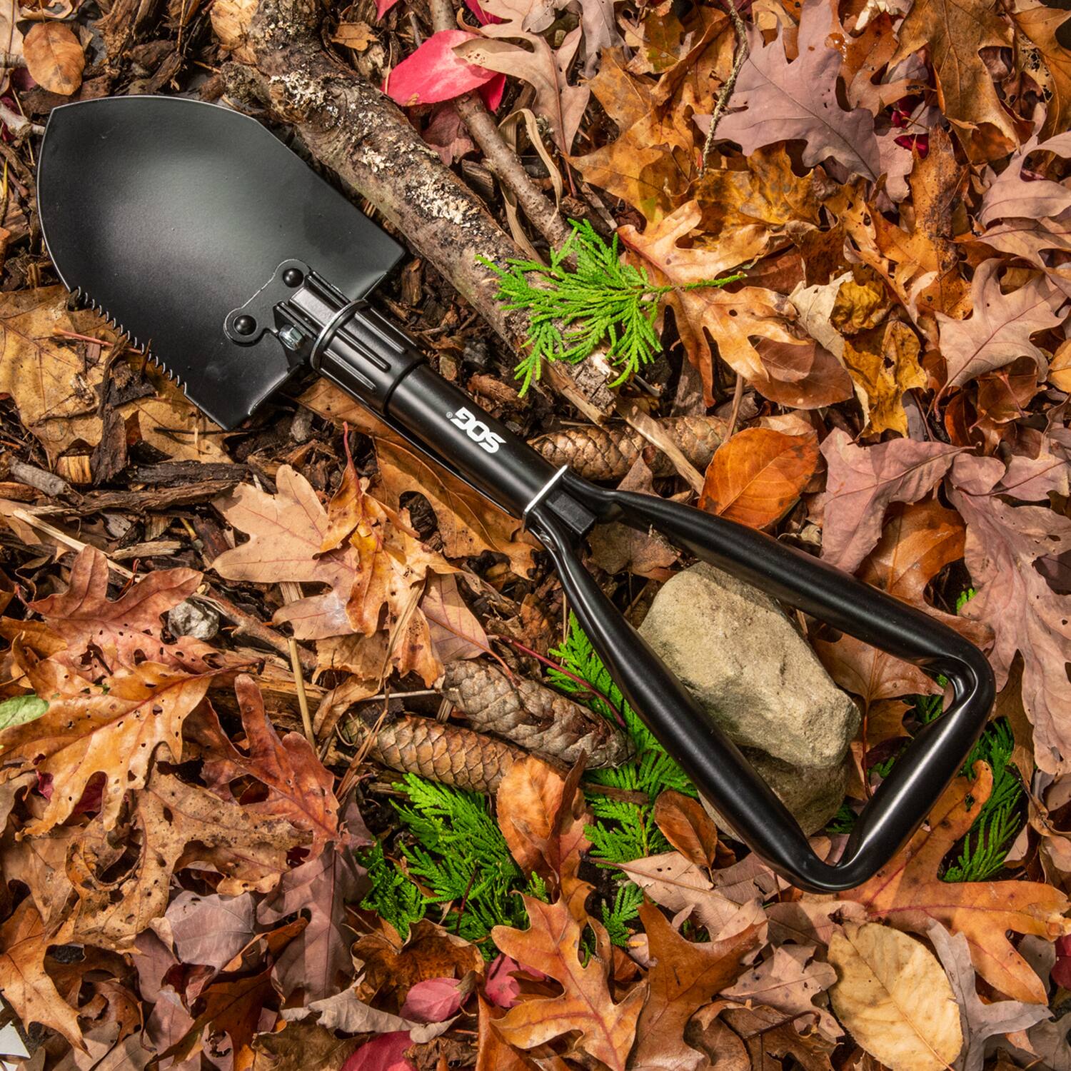 Left. SOG - 3-in-1 Entrenching Tool.