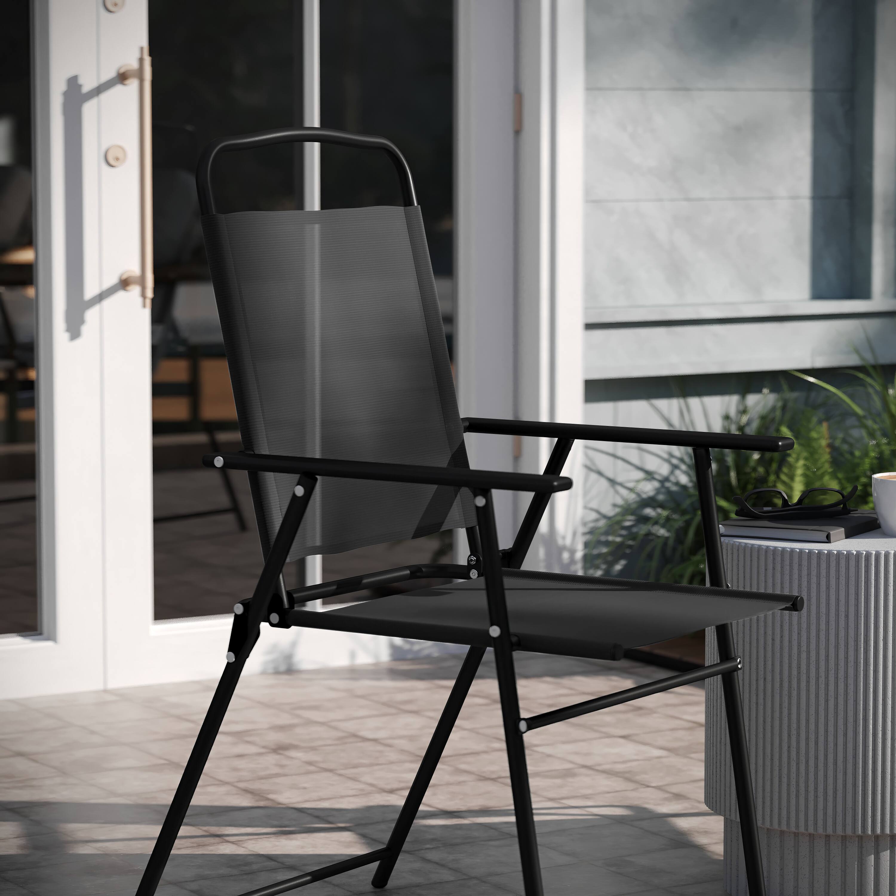 Alt View 5. Emma + Oliver - Munroe Set of 4 Textilene Folding Sling Style Patio Chairs with Armrests - Black.