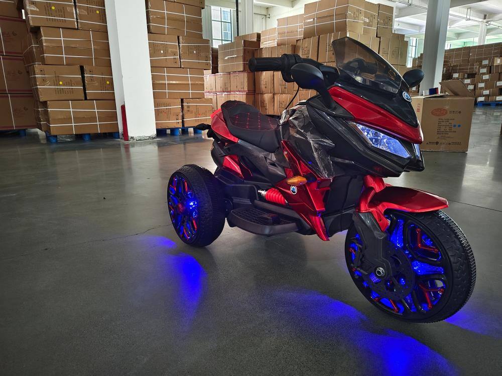 Angle. BreeBe - 12V Kids 3-Wheel Ride On Motorcycle, Battery Powered Motorbike w/ PU Seat, Training Wheels, Manual Throttle, Lights - Red.