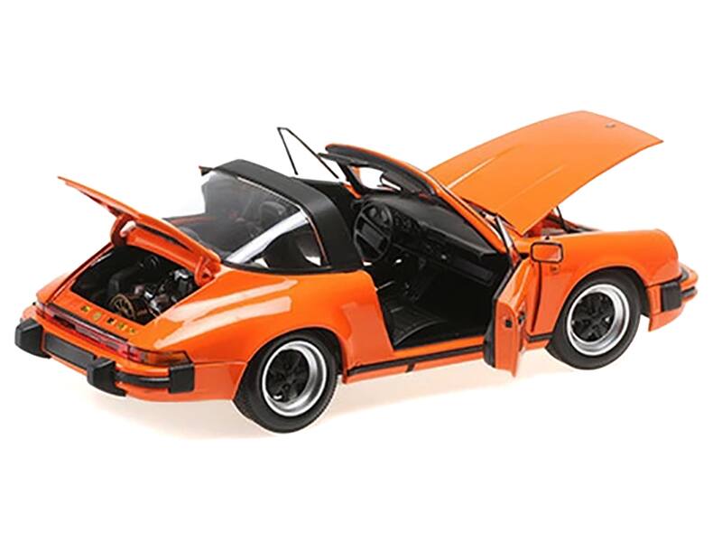 Left. Minichamps - 1983 Porsche 911 Carrera Targa 3.2 Orange 1/18 Diecast Model Car by Minichamps - Orange.