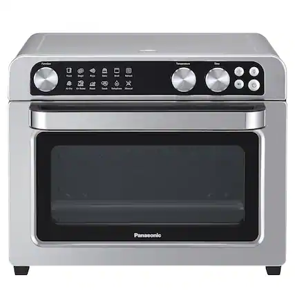 The image features a Panasonic oven with a stainless steel finish. The oven has a digital display and a silver handle. The oven is designed with a variety of functions, including a toast function, bagel function, pizza bake function, and reheat function. It also has a dehydrate function and a manual defrost function. The oven is a versatile appliance that can handle various cooking tasks.
