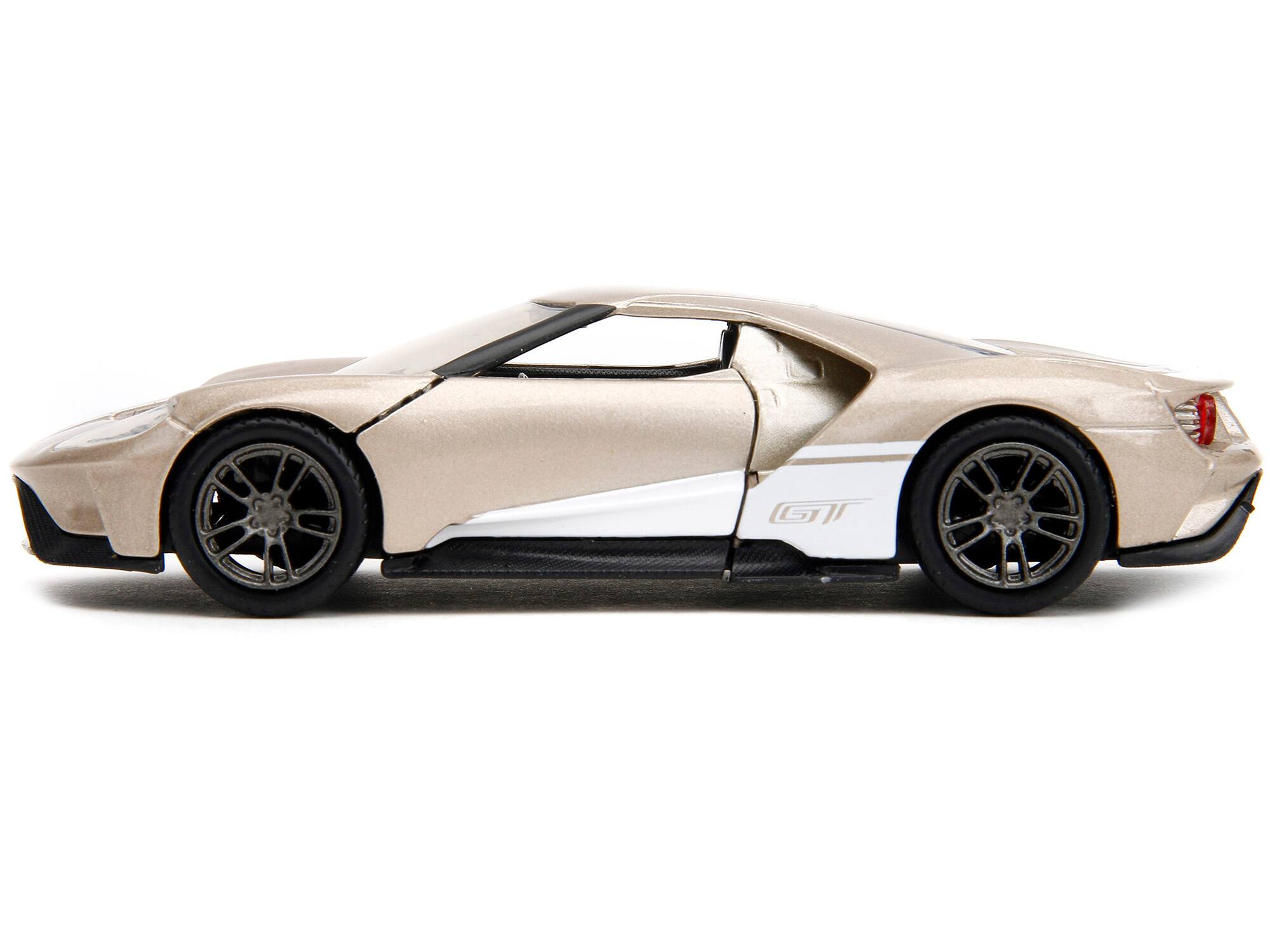 Left. Jada - 2017 Ford GT Gold Metallic with White Accents "Pink Slips" Series 1/32 Diecast Model Car by Jada - Gold Metallic With White.