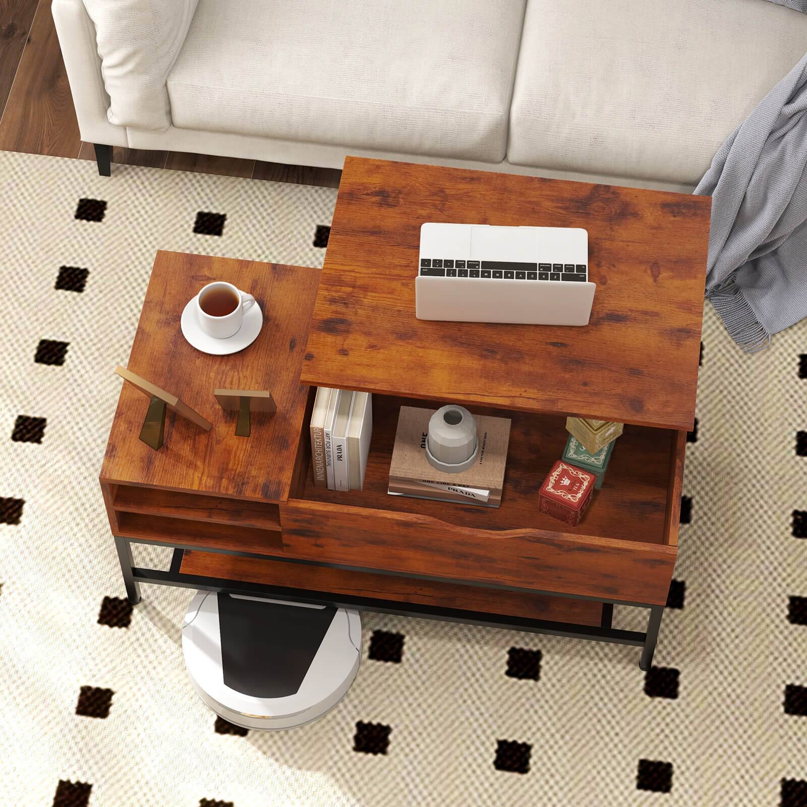 The image features a wooden coffee table with a laptop, keyboard, and mouse on top. There are also several books and a cup placed on the table. The table is situated in front of a couch, and the overall scene is set on a checkered carpet.