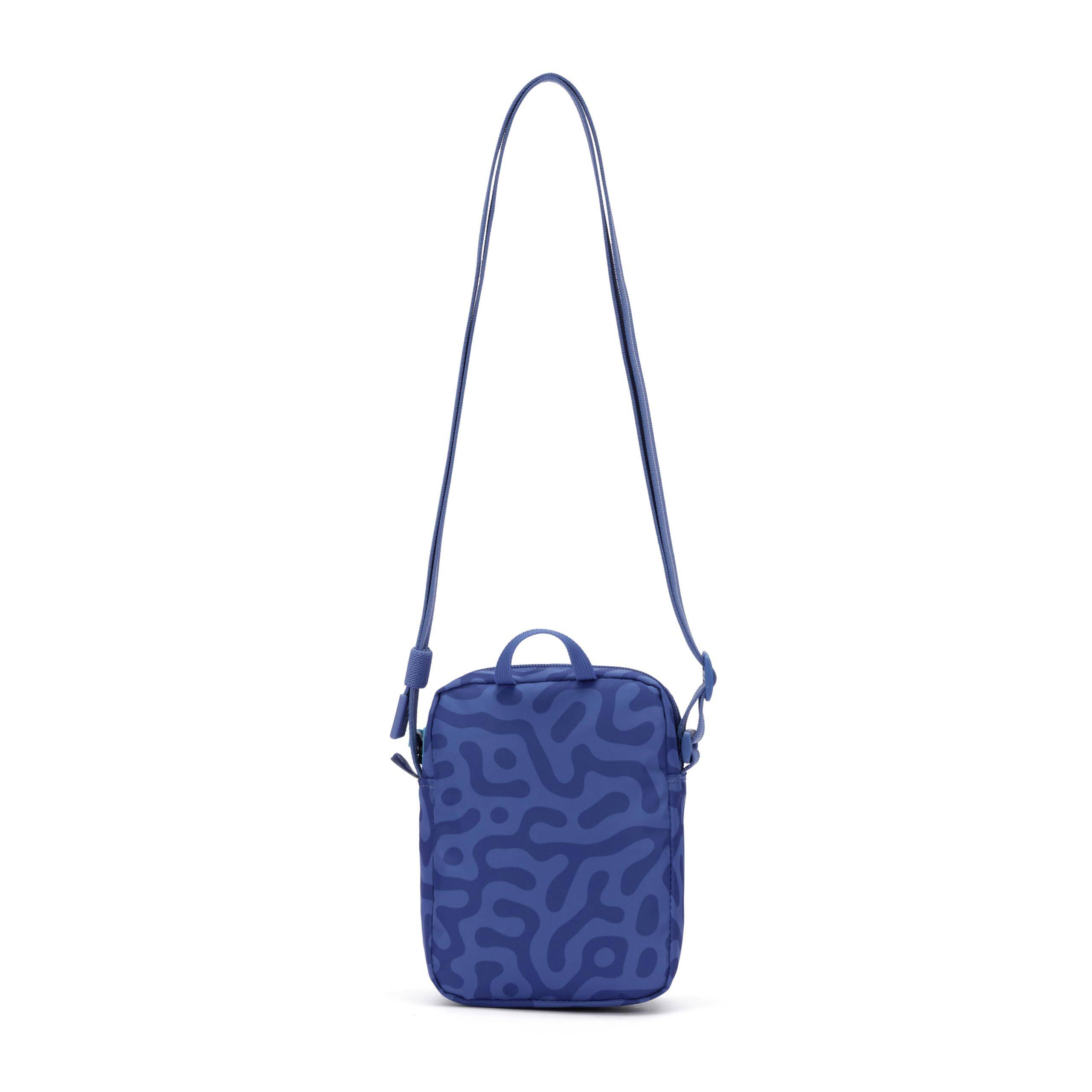 Left. Pacsafe - GO Micro Crossbody - Cerulean Blue.