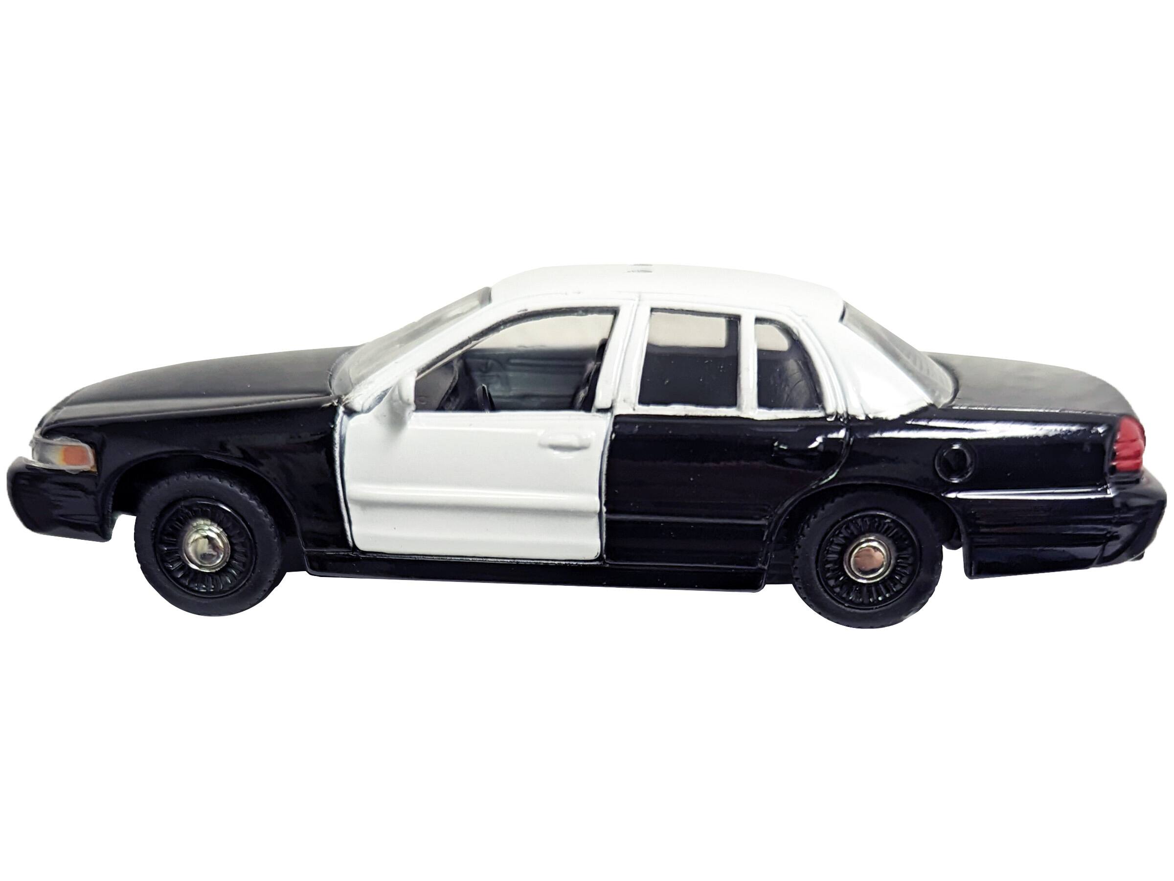 Left. Motormax - Ford Crown Victoria Police Interceptor Black and White 1/43 Diecast Model Car by Motormax - Black And White.