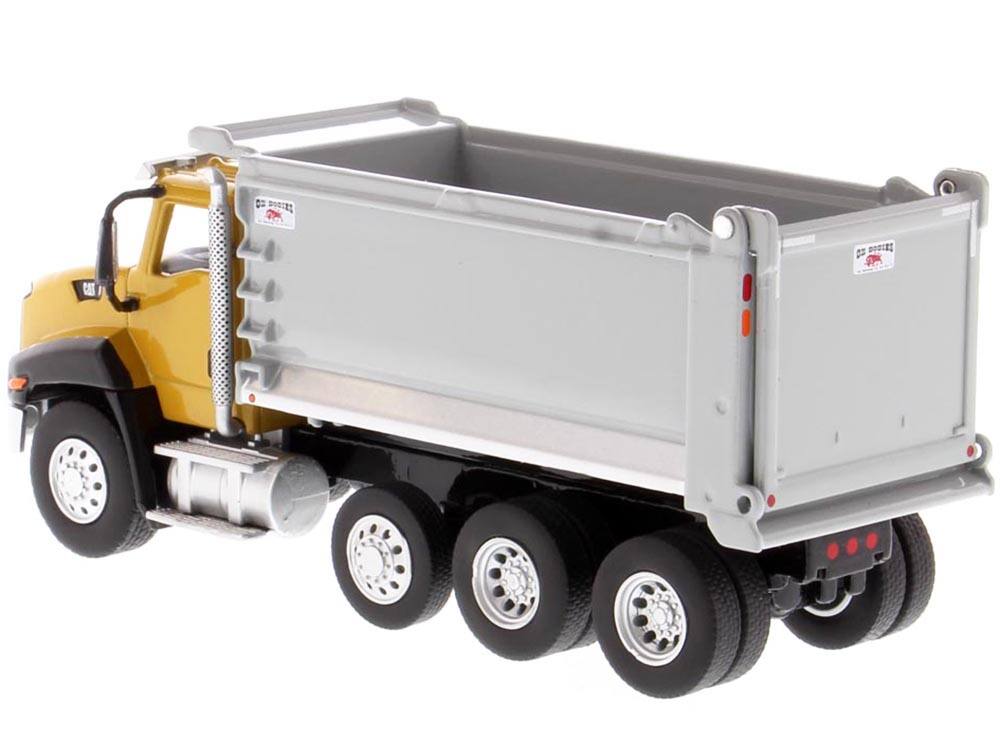 Left. Diecast Masters - CAT Caterpillar CT660 Day Cab Tractor with OX Stampede Dump Truck "Play & Collect!" Series 1/64 Diecast - Yellow .