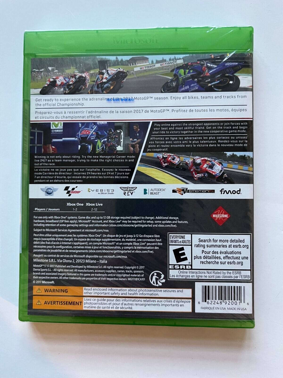 Here is the corrected and grouped text from the image:

---

**MotoGP™ 2017**

Get ready to experience the adrenaline of the 2017 MotoGP™ season. Enjoy all bikes, teams, and tracks from the official Championship.

Préparez-vous à ressentir l'adrénaline de la saison 2017 MotoGP™. Profitez de toutes les motos, équipes et circuits du championnat officiel.

Play online against the strongest opponents or join forces with your best and most skilled friend. Get on the track and begin your ride to victory together.

Affrontez en ligne les adversaires les plus coriaces ou unissez vos forces avec votre ami le plus talentueux pour un ride vers la victoire dans le nouveau mode coopératif.

Winning is not only about riding. Try the new Managerial Career mode: live 24/7 as a team manager, trying to make the right choices and outsmart the competition.

La victoire ne se joue pas que sur l'asphalte. Essayez le nouveau mode carrière de directeur: incarnez un directeur d'écurie et prenez les bonnes décisions pendant 24h/24 et 7j/7 sur une écurie, quels que soient les défis des courses.

**Xbox One**

Players: 1-2 (Single Player), 2-12 (Online)

Xbox Live

Microsoft Account required. Additional storage, hardware broadband required (subject to change). Microsoft Services Agreement (microsoft.com/msa). Subject to Microsoft Services Agreement (microsoft.com/msa).

Microsoft, Xbox, Xbox Live, and the Xbox logos are trademarks of the Microsoft group of companies.

Milestone S.r.l. Via Olona 2, 20123 Milano - Italia

© 2017 Milestone S.r.l. All rights reserved. All manufacturers, accessory suppliers, names, tracks, sponsors, and associated logos are trademarks and/or copyrighted materials of their respective owners. MotoGP™ and related marks are trademarks of Dorna Sports SL.

---

**Warning**

Read enclosed information about other important safety and health information.

Avertissement

Lisez ce guide pour des informations importantes sur la santé et la sécurité.

---

**Online Interactions Not Rated by the ESRB**

Les échanges en ligne ne sont pas classés par l'ESRB