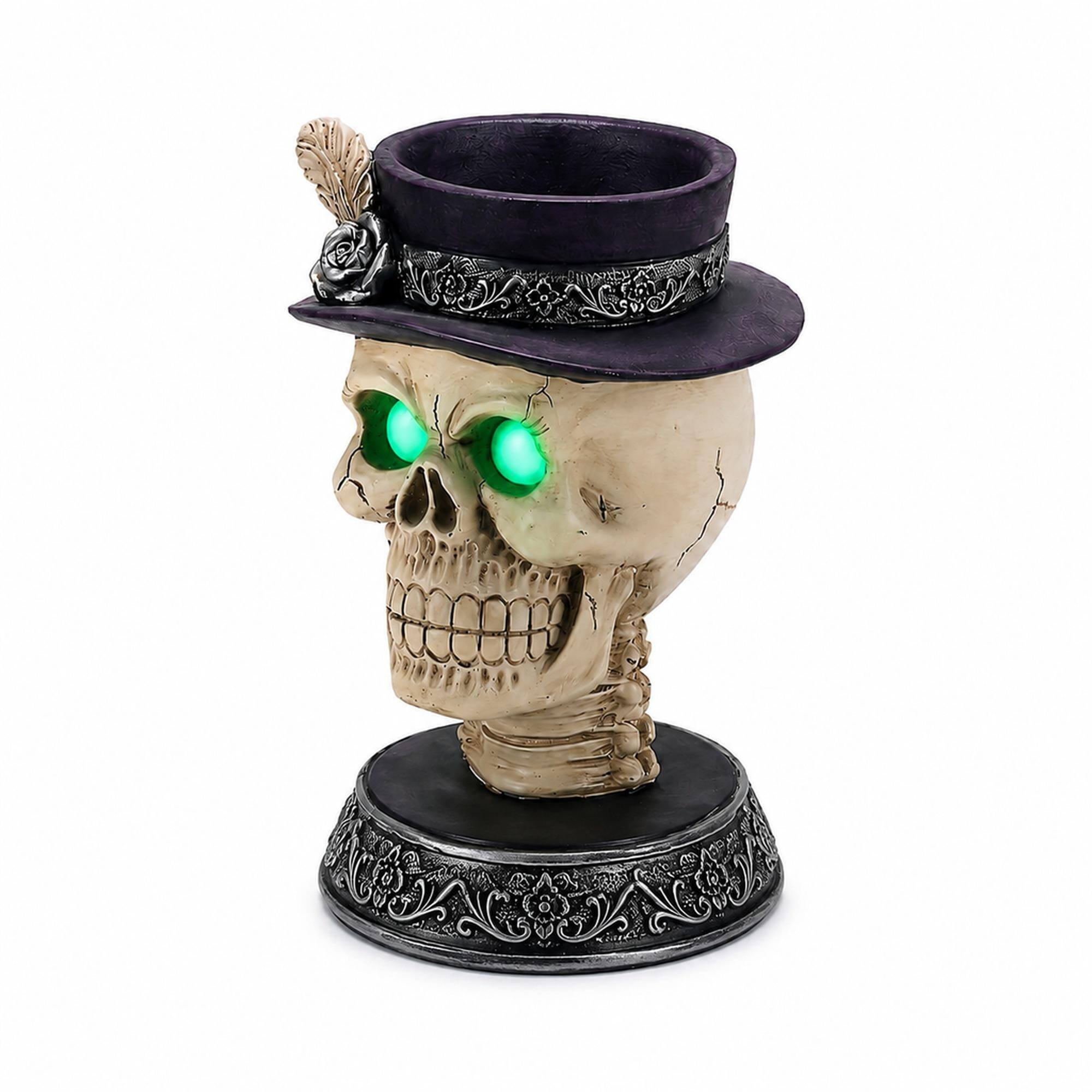 Front. RYHNUYNE - Gothic Skull Candle Holder Statue with Glowing Green LED Eyes and Victorian Feather Top Hat for Spooky Halloween - Black.