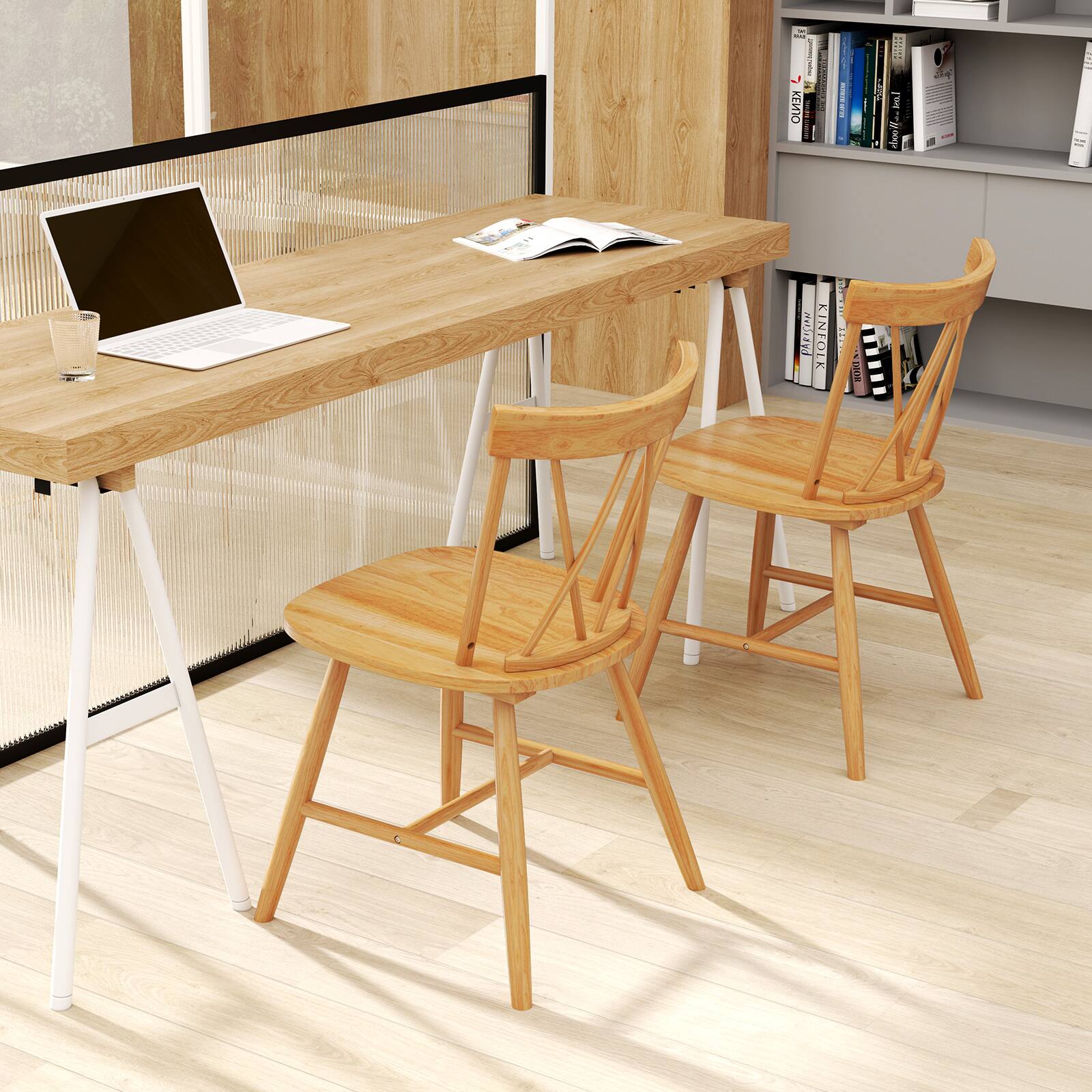 The image features a wooden table with a laptop and a book on it. There are three wooden chairs placed around the table, and a glass of water is also present on the table. The scene appears to be a workspace or a study area.