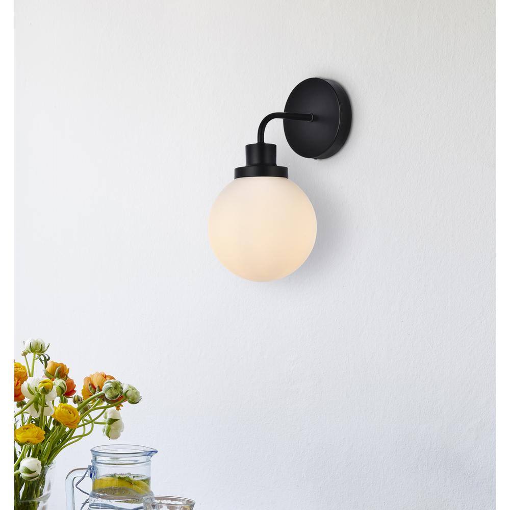 Angle. Living District - Hanson 1 light bath sconce in black with frosted shade - Black And Frosted Shade.