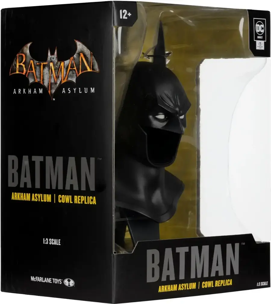 The text on the image reads: "12+ RAEA ARKHAM ASYLUM DC I T DRECT - TM BATMAN ARKHAM ASYLUM I COWL REPLICA 1:3 SCALE McFARLANE TOYS TM BATMAN REPLICA SCALE I COWL I ARKHAM ASYLUM."
