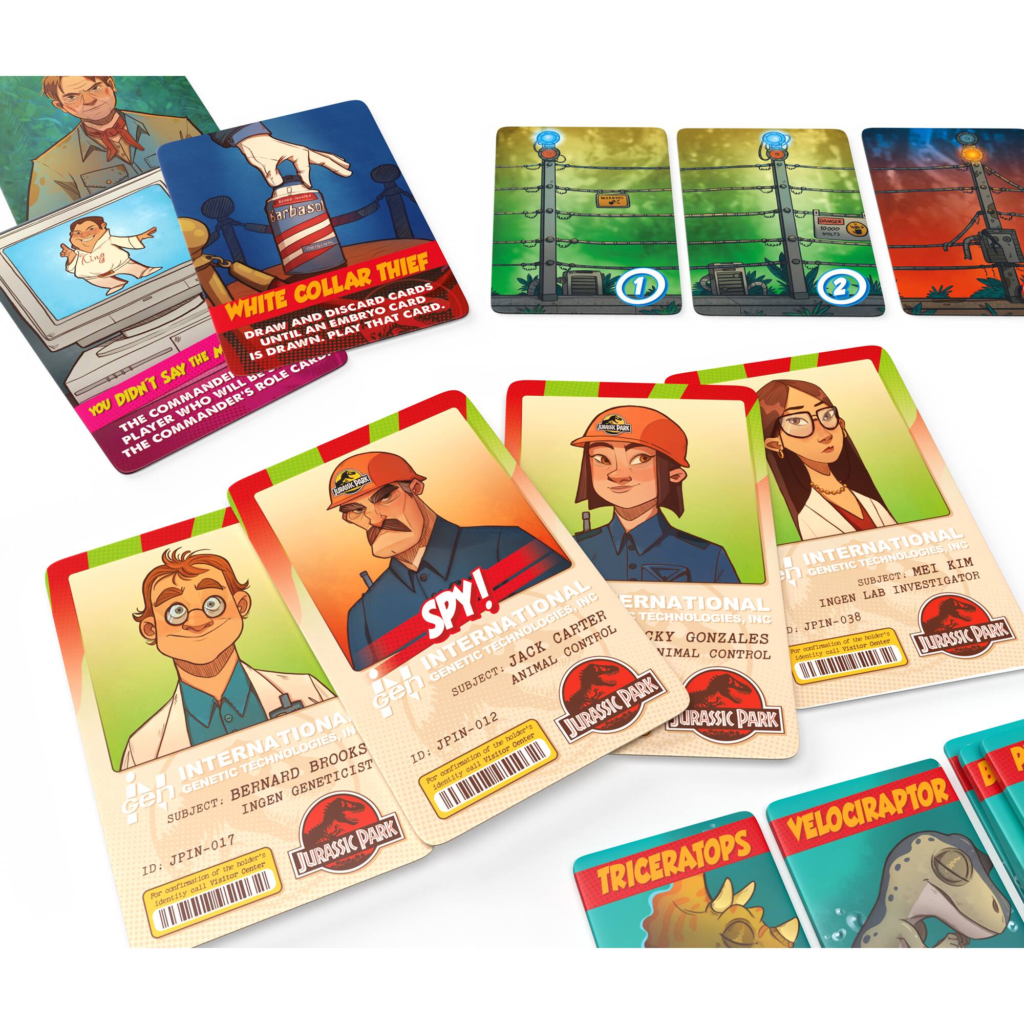 The image features a collection of cards, including a set of Jurassic Park cards. The cards are laid out on a table, and there are a total of 15 cards in the collection. The cards are colorful and have various designs, including some that feature dinosaurs. The cards are likely meant for a game or a collectible set, as they are organized and displayed together.