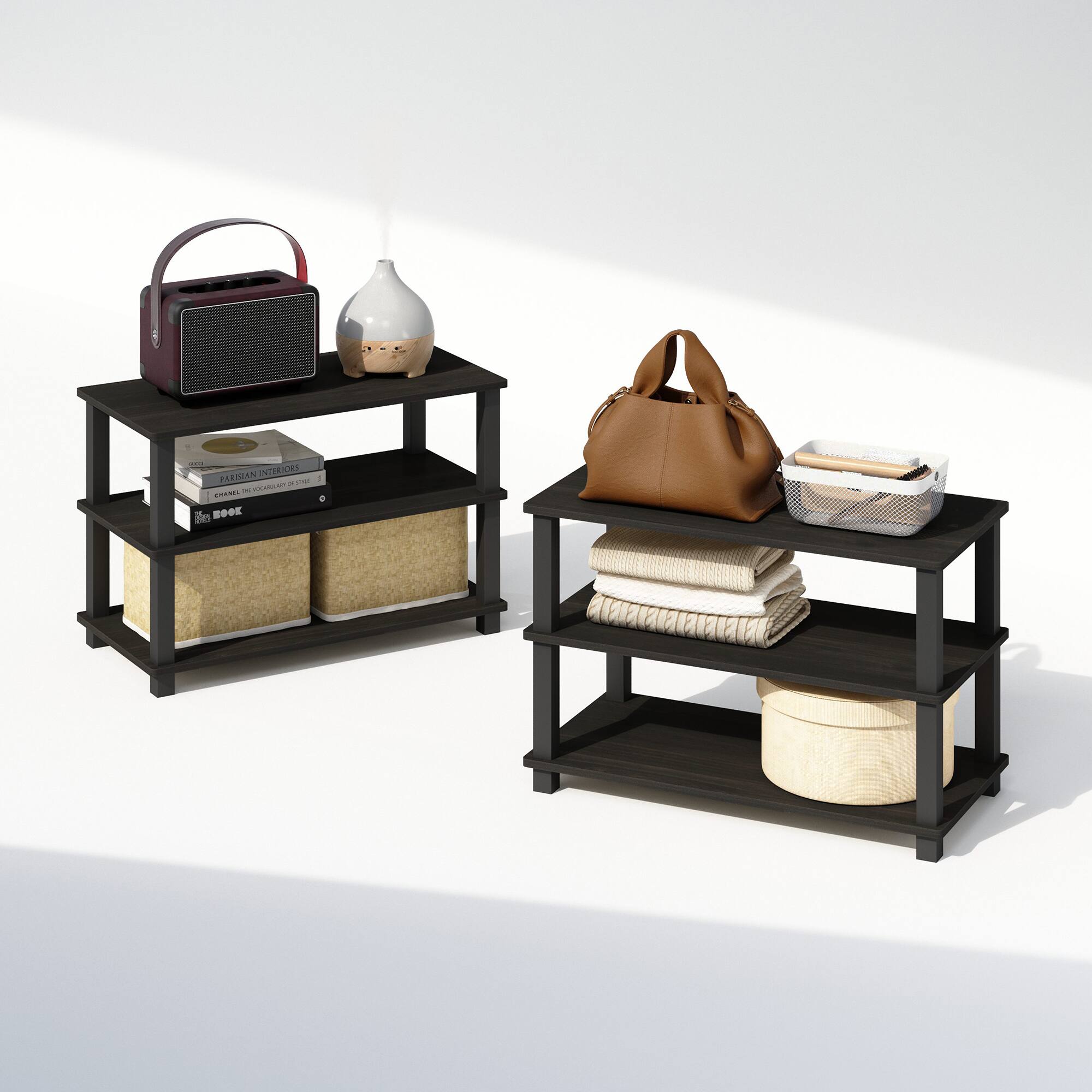 Certainly! Here is the corrected and grouped text from the image:

---

**Top Shelf:**
- Radio
- Ceramic Vase

**Middle Shelf:**
- "DANISH INTERIORS"
- "CHANEL THE WORLD OF STYLE"
- "THE BOOK"

**Bottom Shelf:**
- Wicker Basket

**Right Shelf:**
- Brown Handbag
- Wicker Basket
- Folded Towels
- Round Cushion

---