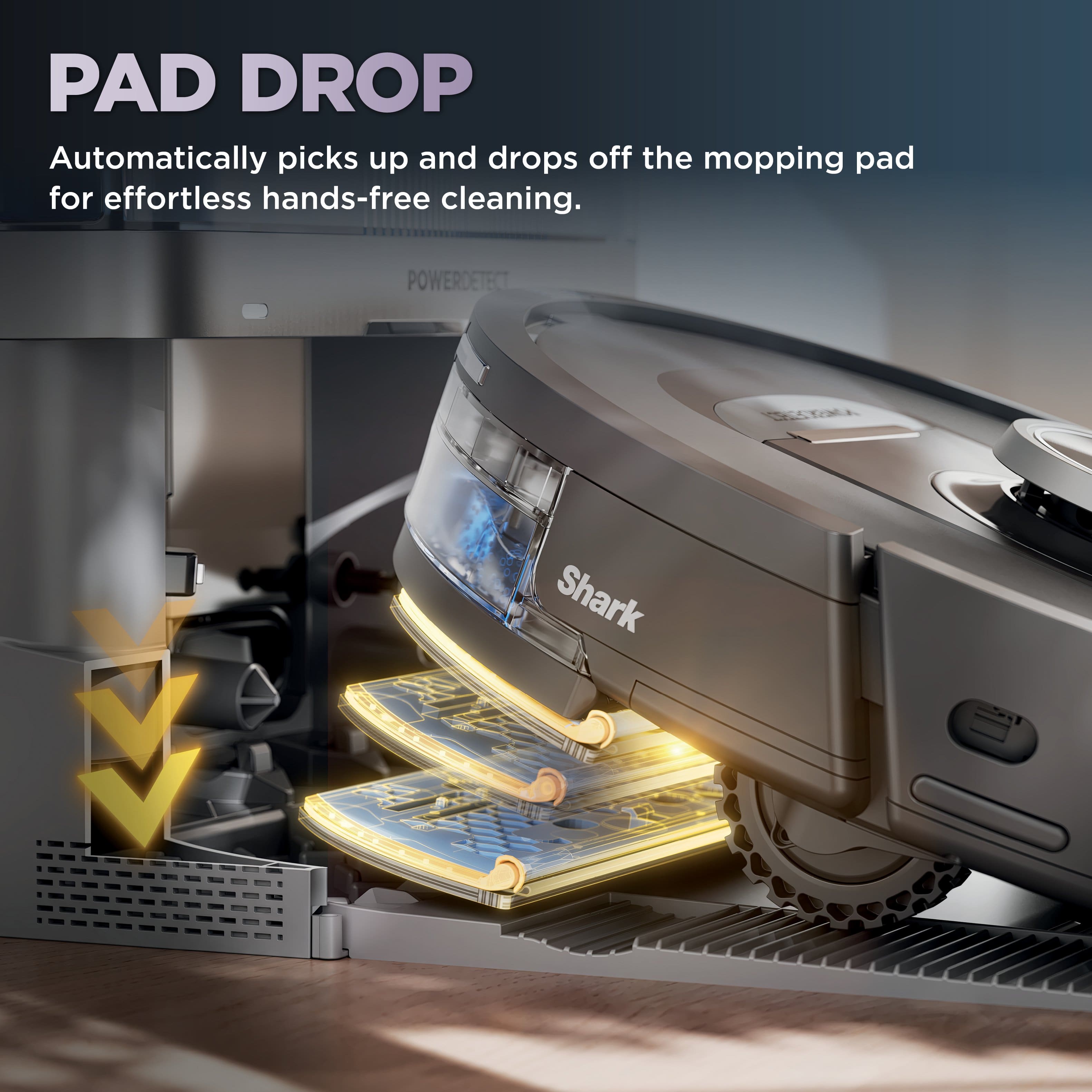 The image features a Shark floor cleaner with a pad drop system. The pad drop system automatically picks up and drops off the mopping pad for effortless hands-free cleaning. The image also shows a close-up of the pad drop system in action.