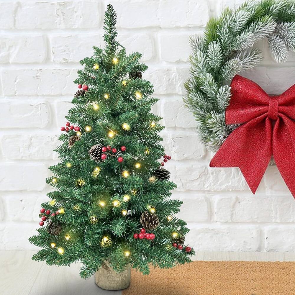 Left. RTMB - 3ft Pre-Lit Mini Christmas Tree with 121 PVC Branch Tips, Pine Cones, Red Berries, 70 LED Lights, Battery Operated - Warm White.