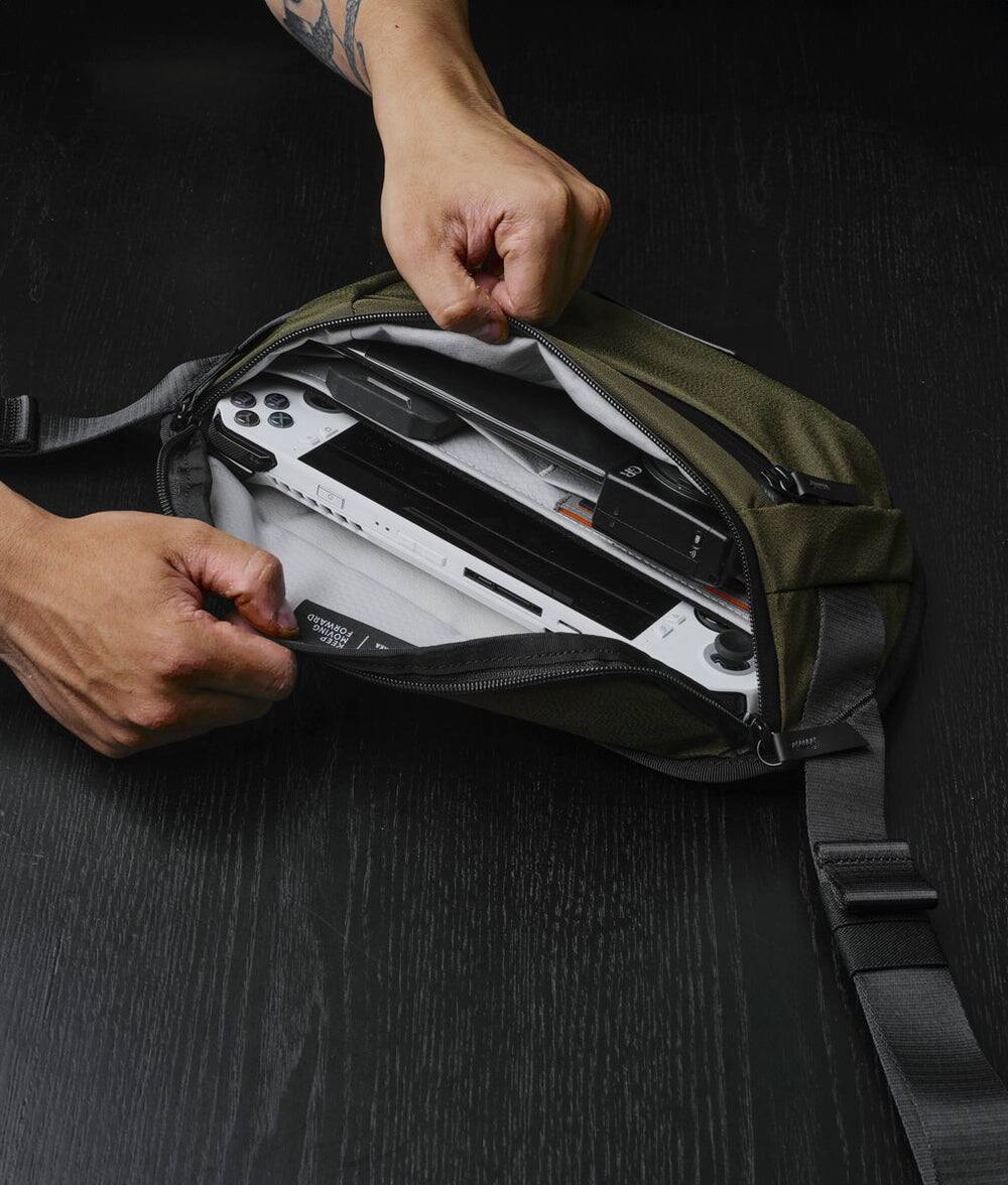 Alt View 2. ALPAKA - Sling Bag Bag for Men, Fits iPad Mini & Switch OLED, Hidden Rear Pocket, Magnetic Buckle, YKK AquaGuard Zippers - Army Green Axoflux 300D.
