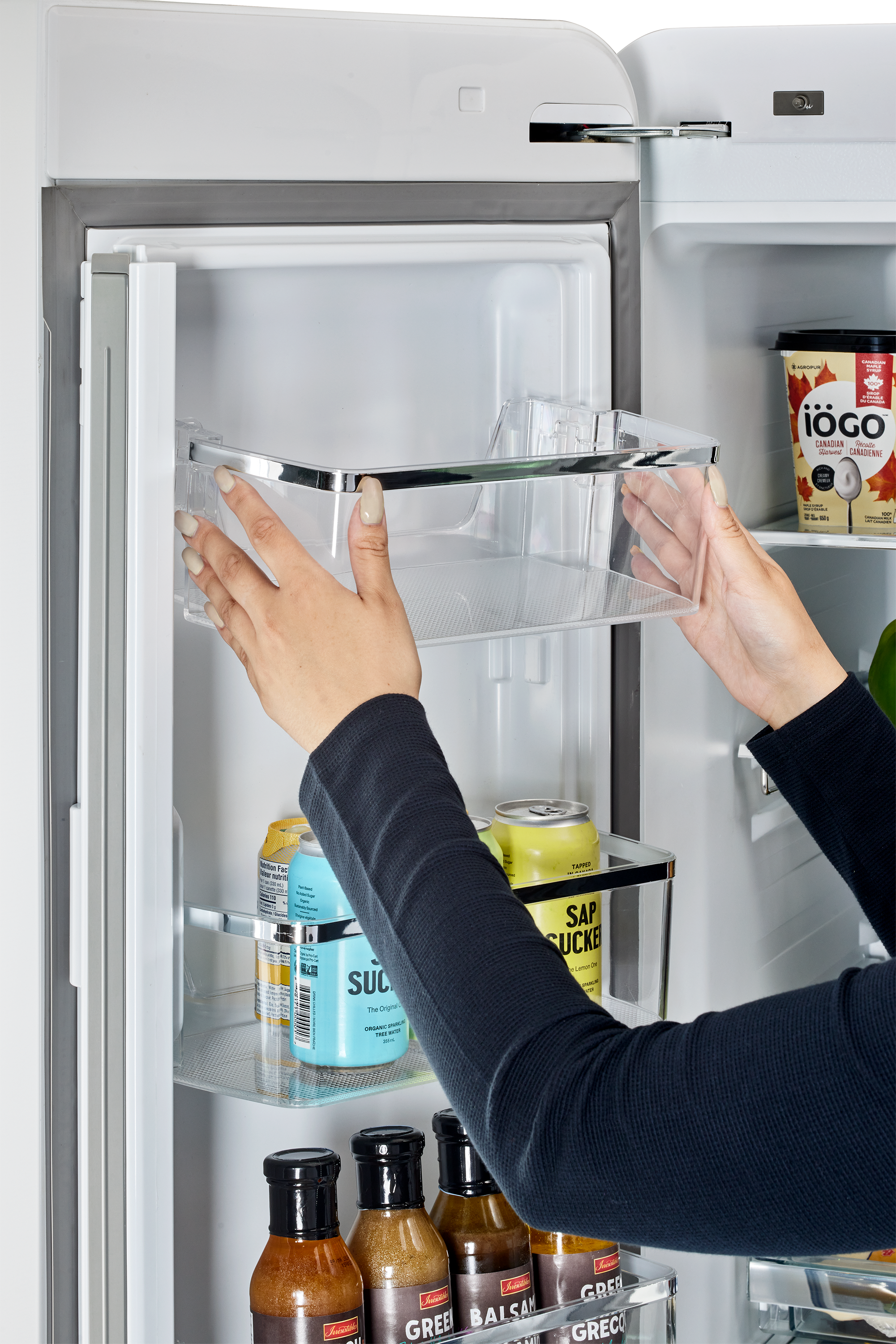 The text on the image reads: "iGO CONADIAN - Atver CANADIEN - Nertion Fac - NED - 90 SUC iN Orgn CAET - a - Tarm SAP SUCKE L - 1 1 Auan i Sam Laiaa GREA Sasiae A GREE BALSAN tl GRECO Adaa." This text appears to be a mix of French and English words, but it does not form coherent sentences or phrases in either language.