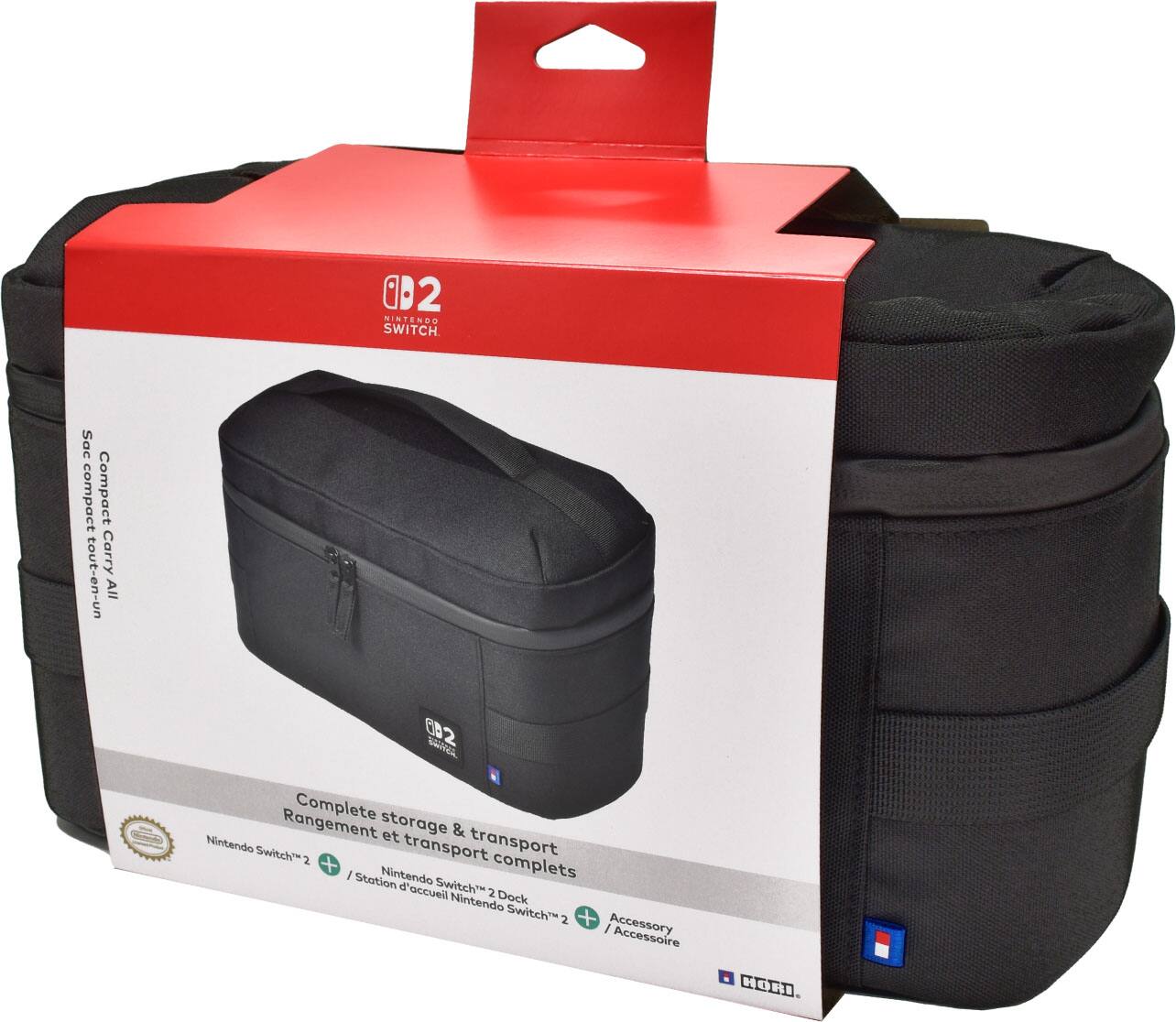 The text on the image is in French, so I will provide the corrected text in French as well:

"0B2 : NINTENDO SWITCH Sac compact Compact Carry tout-en-un All 002 2 SAHIA Complete storage Rangement et & transport Nintendo transport Swwitch" 2 + complets I Station Nintendo d'accueil Switch 2 Nintendo Dock Switch 2 +  Accessory Accessoire HONI"

The corrected text is a combination of the original text with some minor adjustments to improve the readability and grammar.