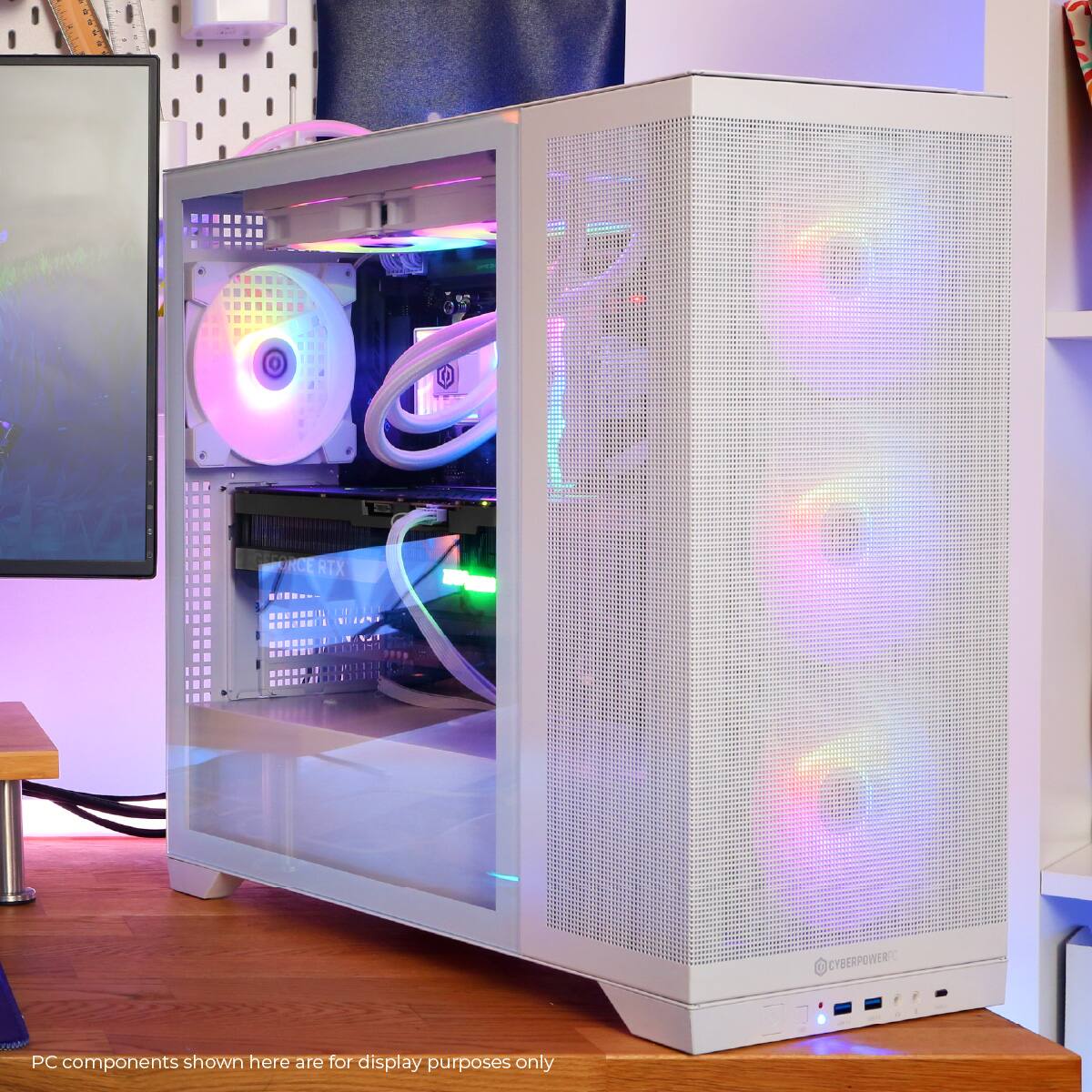 The image shows a computer tower with a purple and green light inside. The PC components are displayed for show purposes only and are not for sale.