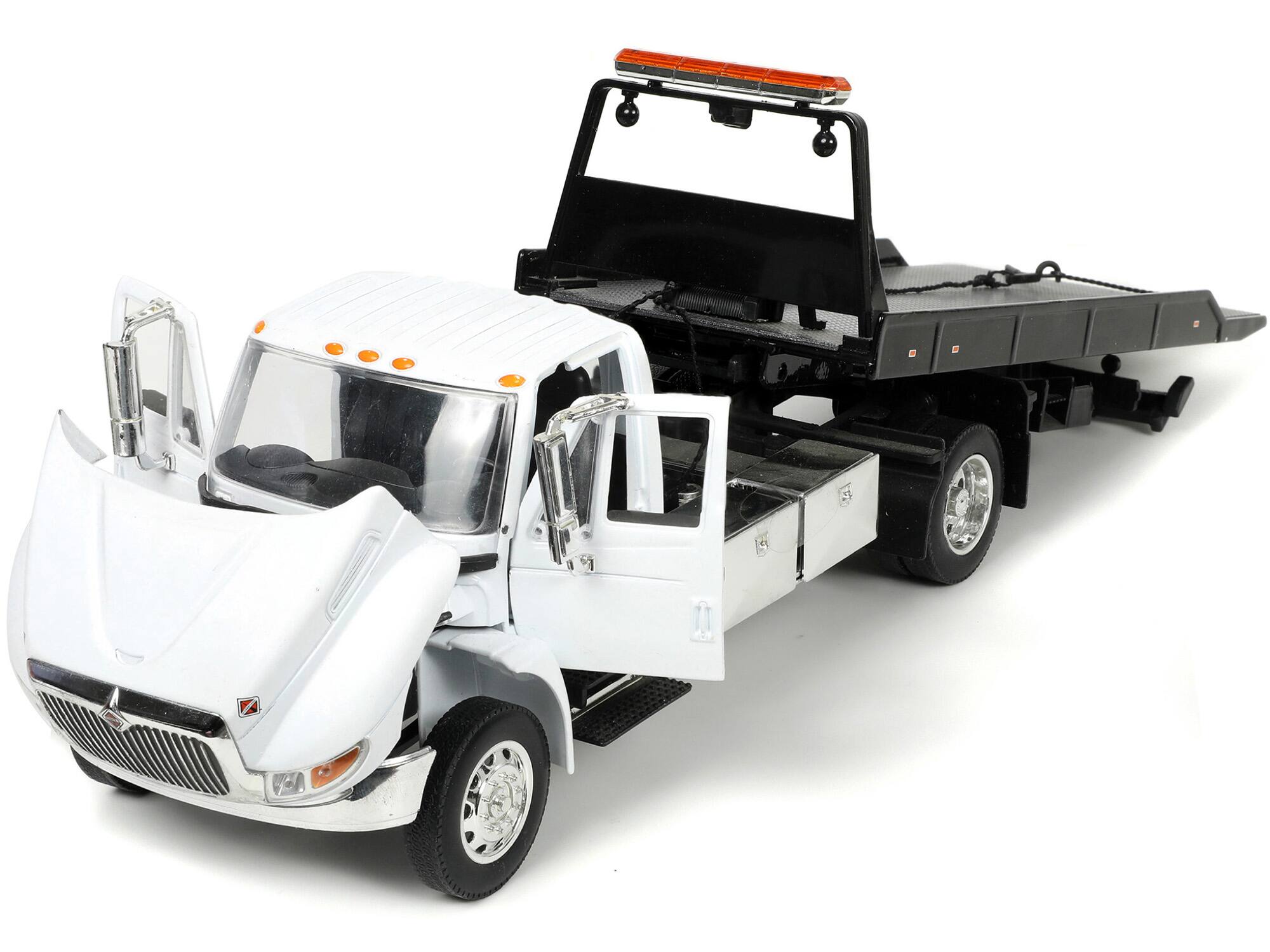 Alt View 1. Jada - International DuraStar 4400 Flatbed Tow Truck White 1/24 Diecast Model by Jada.