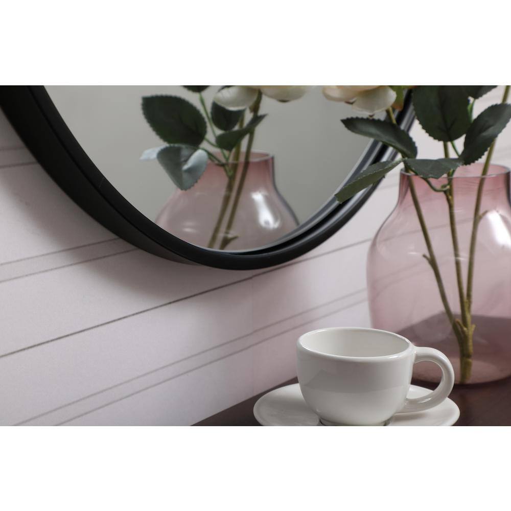 Left. Elegant Decor - Metal frame round mirror with decorative hook 21 inch in Black - Black.
