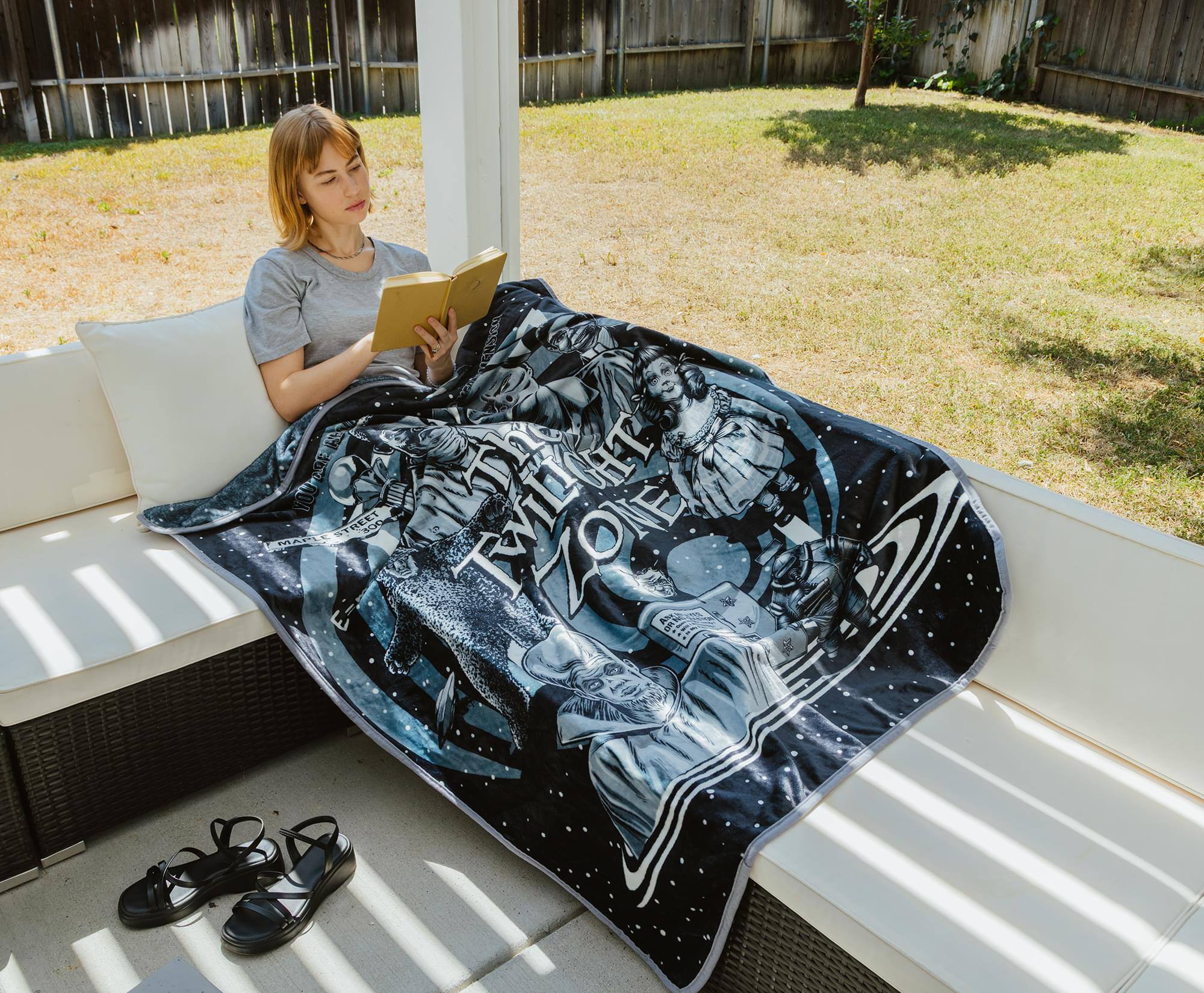 The text on the blanket reads:

"THE
MARVEL
STORY
MARVEL
STORY"
