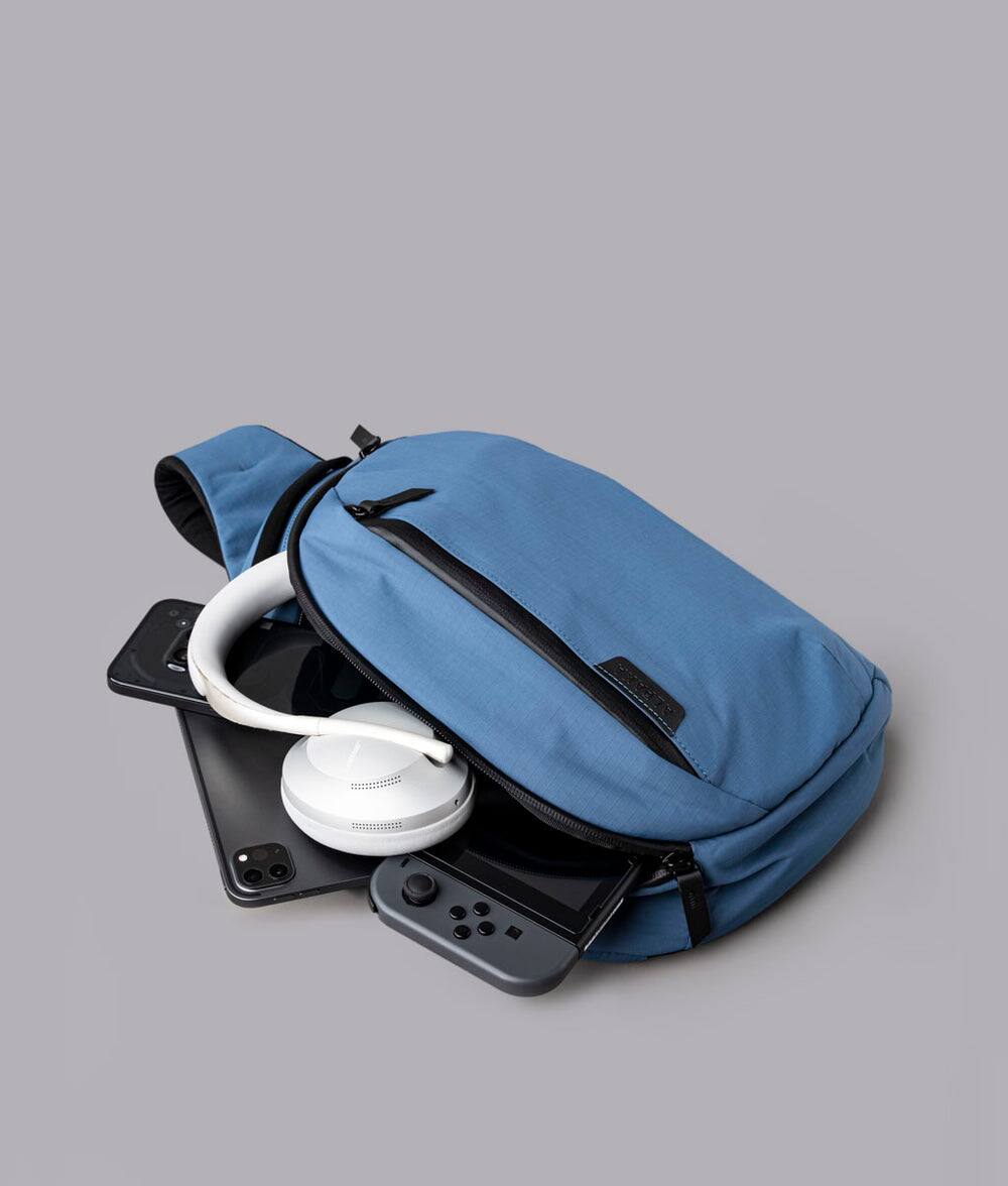 Alt View 5. ALPAKA - Crossbody Sling Bag 7.5L (Right Shoulder) for Men, Fits 11" Tablet, Phone Sleeve, Bottle Pocket, Luggage Pass-Through - Blue Axoflux 210D.