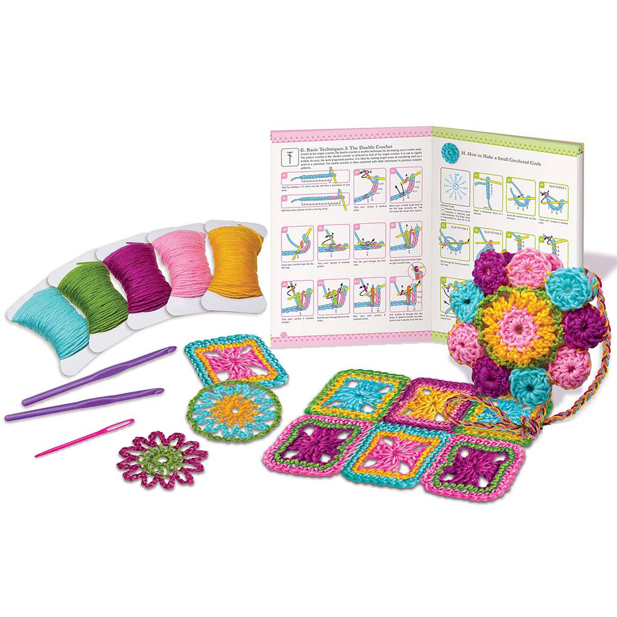 The Double Crochet Lace Book and Kit contains a book with instructions and diagrams, a crochet hook, and a variety of yarn colors. The book is open to page 11, which shows diagrams and instructions for crocheting. The kit also includes a yarn ball and a crochet hook, which are placed on the table next to the book. The book is designed to teach crochet techniques and provide a fun and engaging way to learn the craft.