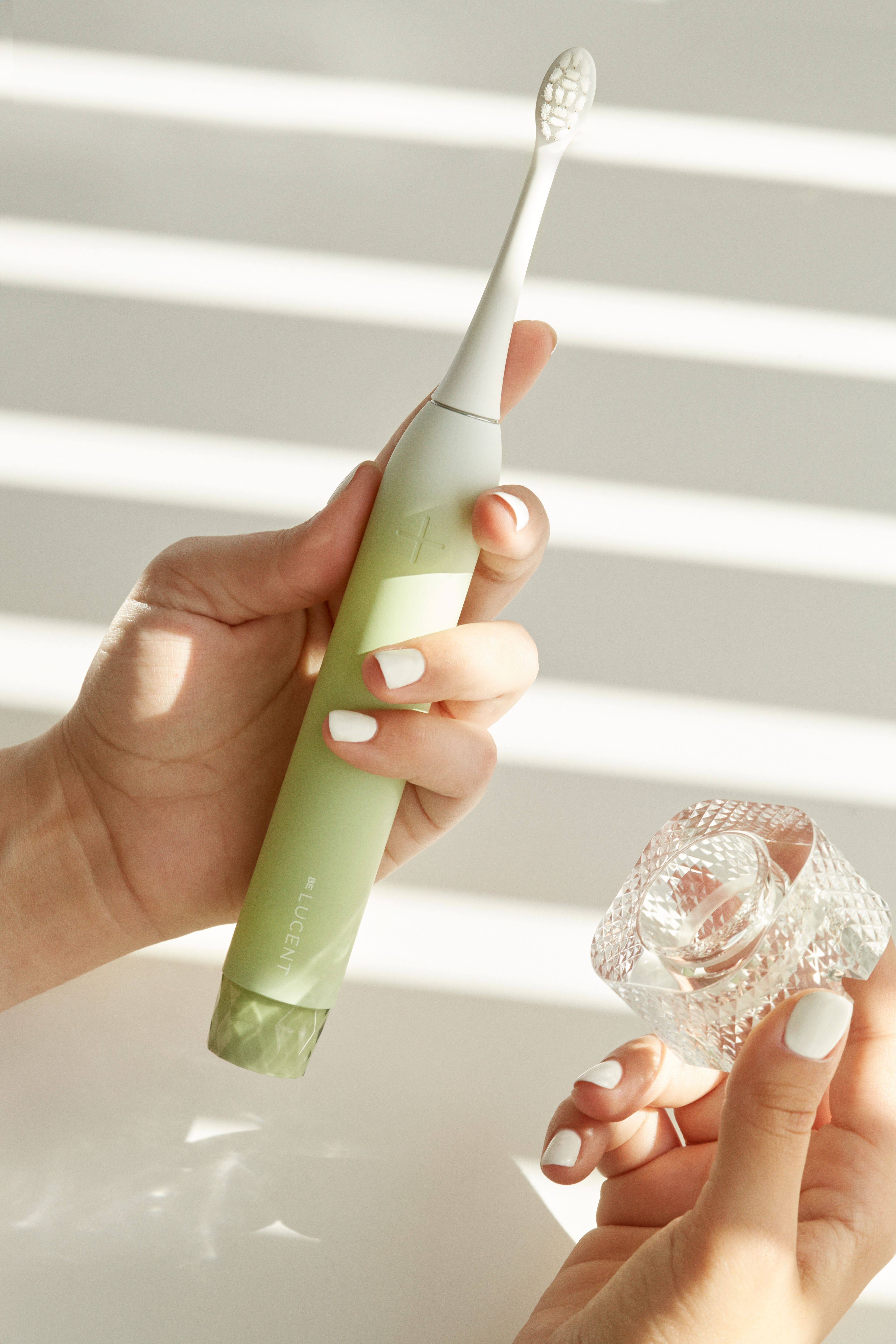 Back. Be Lucent - Sonic Electric Toothbrush that look cosmetically appealing with 3 brush modes.  Last up to 60 days before charging. - Mint.