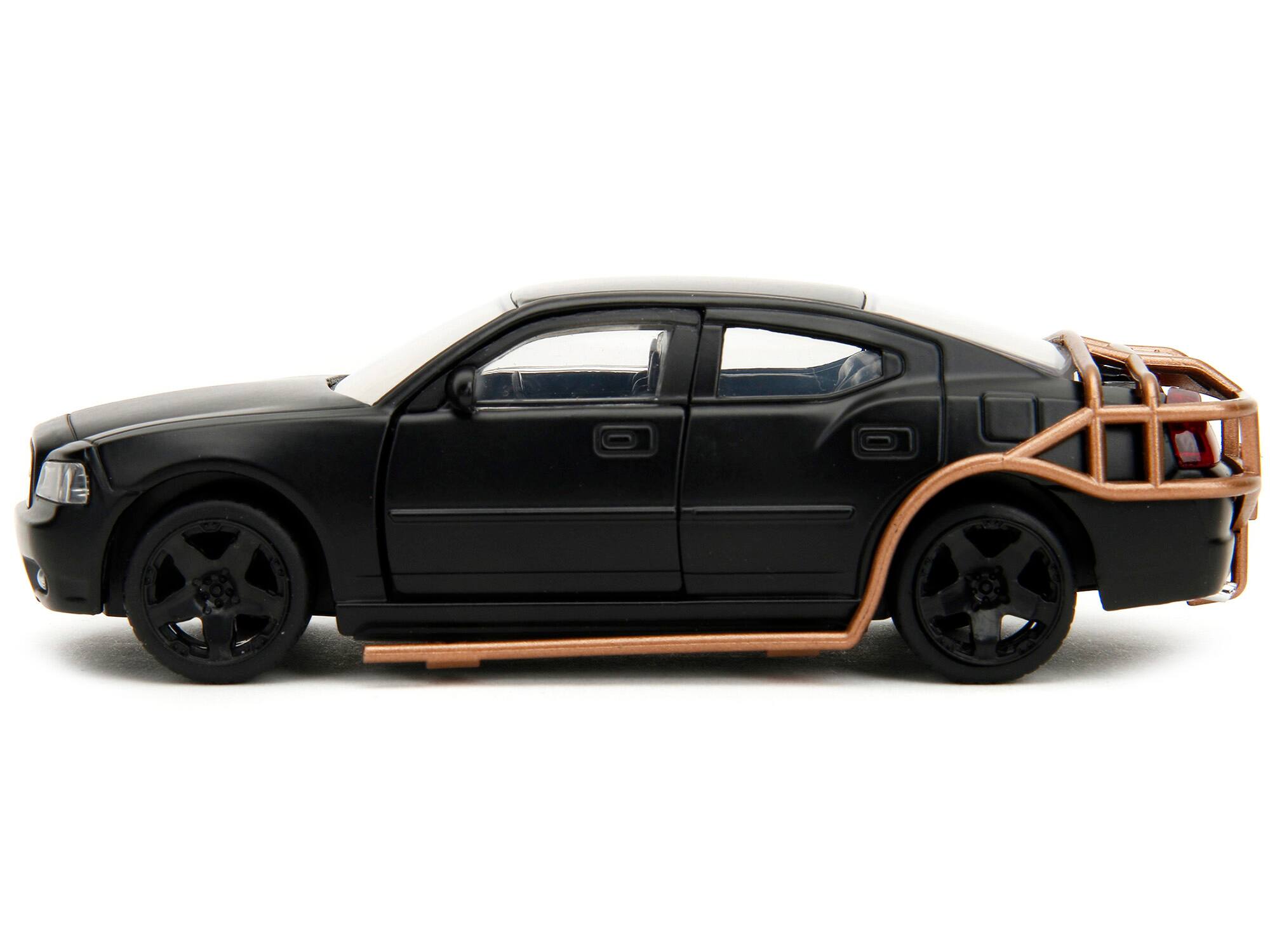 Left. Jada - 2006 Dodge Charger Matt Black with Outer Cage "Fast & Furious" Series 1/32 Diecast Model Car by Jada - Matt Black.