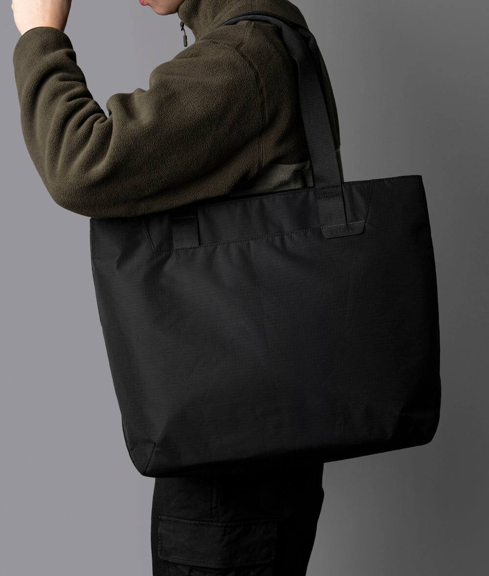 Alt View 1. ALPAKA - Elements Tote 20L Laptop Tote Bag with Padded 16" Sleeve,Open Top with Magnetic Closure - Black Axoflux 210D.