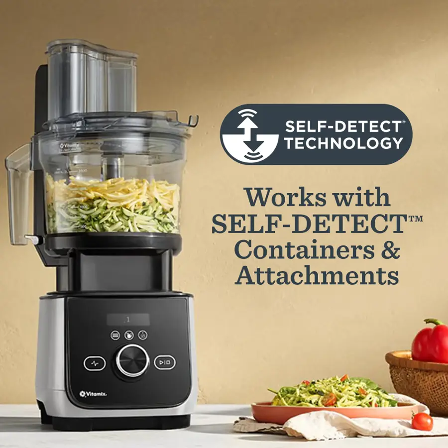 The image features a blender with a bowl of food on the counter. The blender is described as having a Self-Detect Technology, which works with Self-Detect Containers and Attachments. The image also shows a bowl of food next to the blender, suggesting that it has been prepared using the blender.