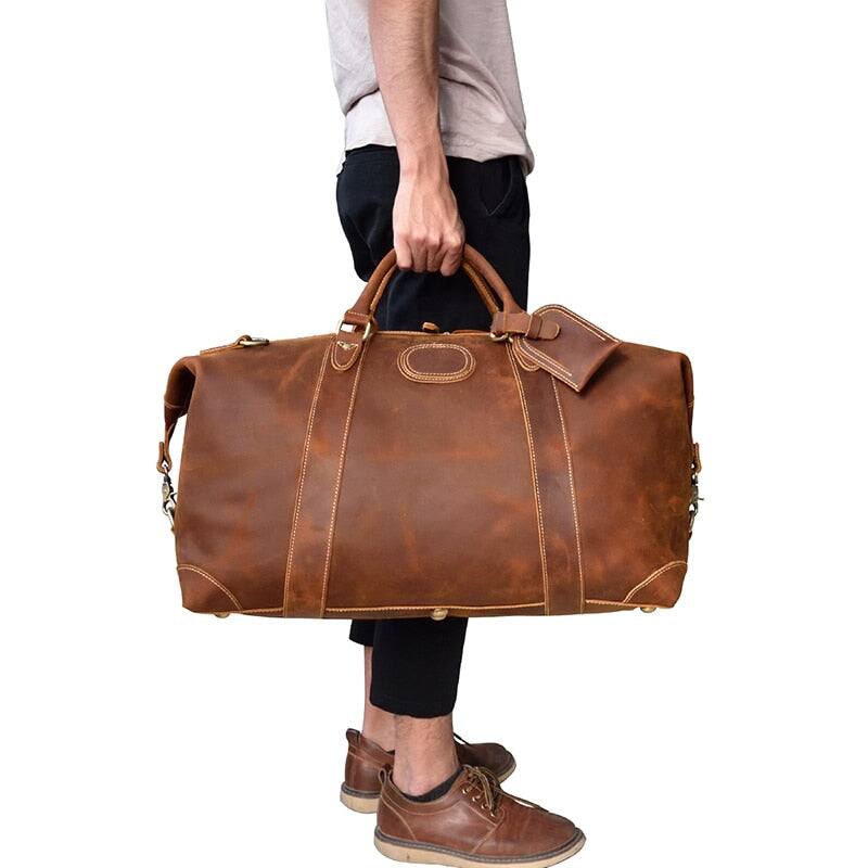 Angle. Steel Horse Leather - The Eira Duffle Bag | Vintage Leather Weekender - Brown.