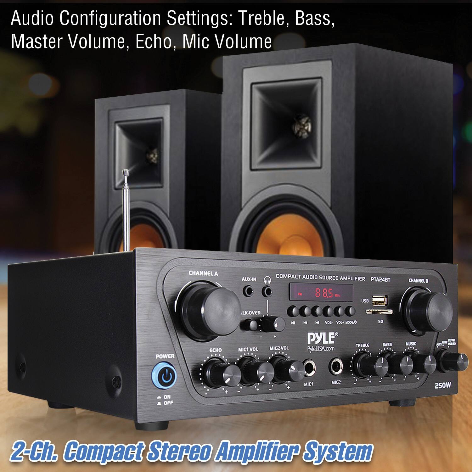The image features a compact stereo amplifier system with a 2-ch compact audio source amplifier. The system has a treble, bass, master volume, and echo mic volume configuration settings. The amplifier is accompanied by two speakers, one on the left and the other on the right. The Pyle brand is visible on the amplifier, and the system is designed for 250W of power. The amplifier is placed on a wooden table, and the speakers are positioned in front of it.