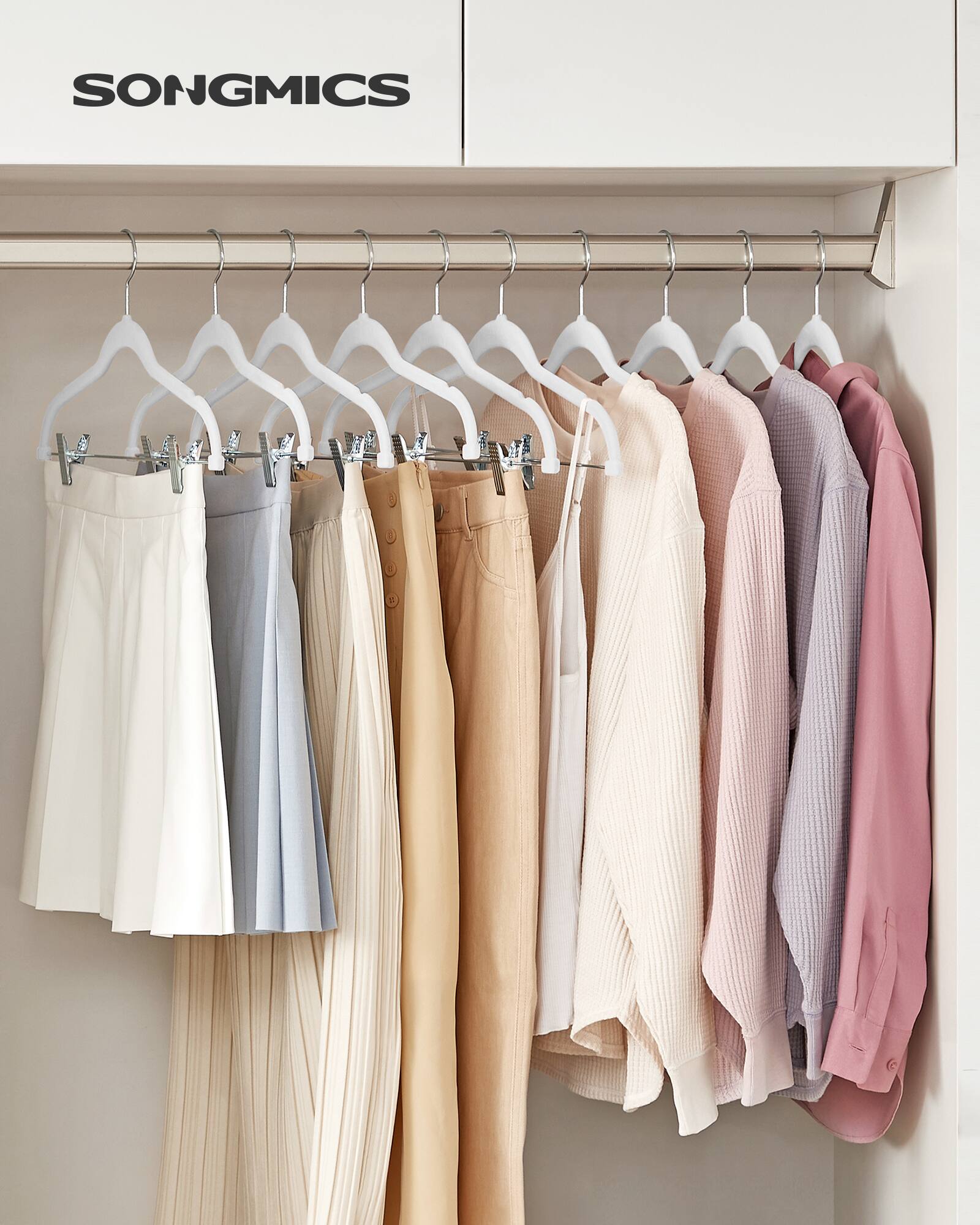 Angle. Songmics Home - 30-Pack Pants Hangers, 16.7-Inch Long Velvet Hangers with Adjustable Clips, Heavy-Duty, Non-Slip Skirt Hangers - Cloud White.