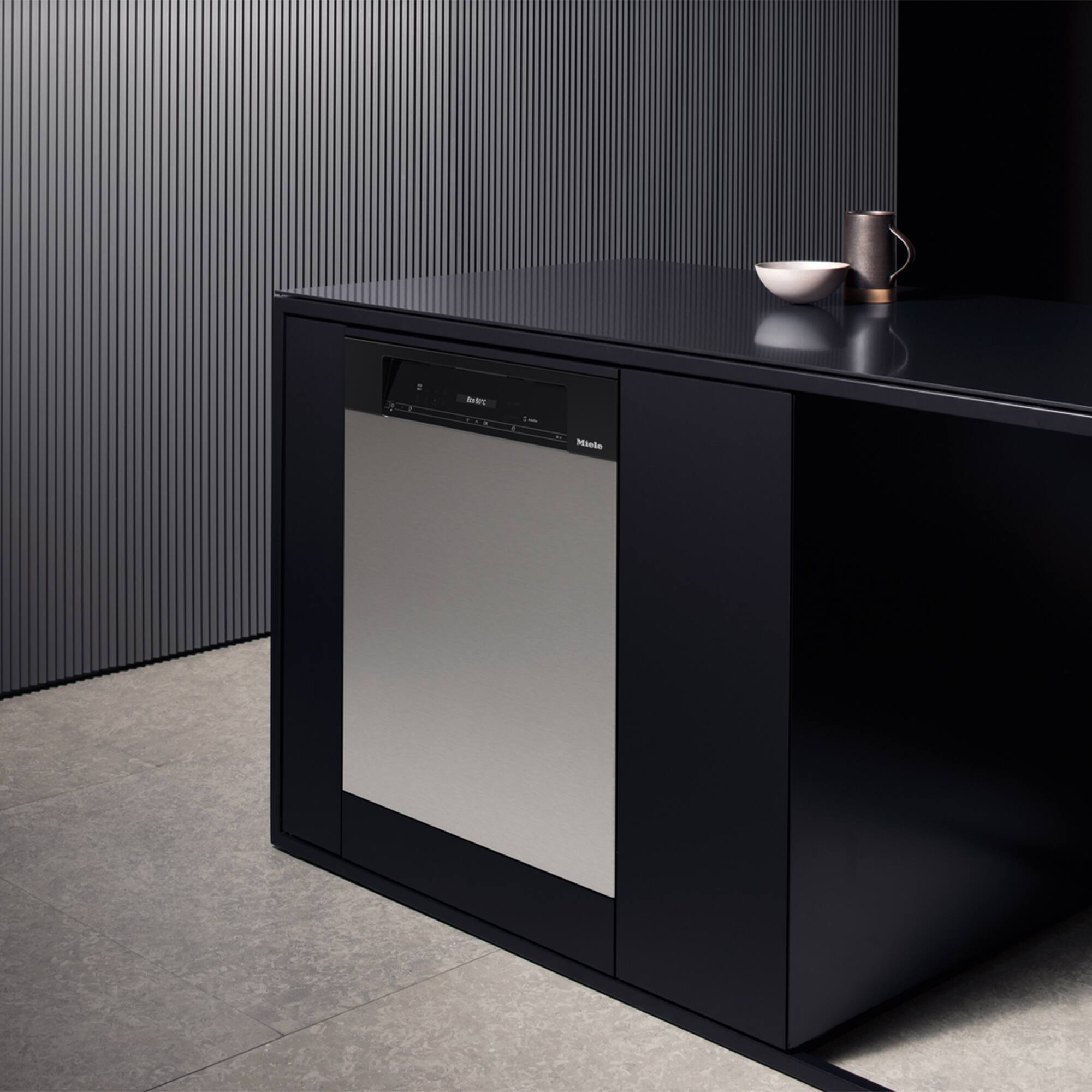 Angle. Miele - Miele GFV 60/65-7  24" Clean Touch Steel Dishwasher Door Panel for integrated models G7000/G5000 Dishwashers.