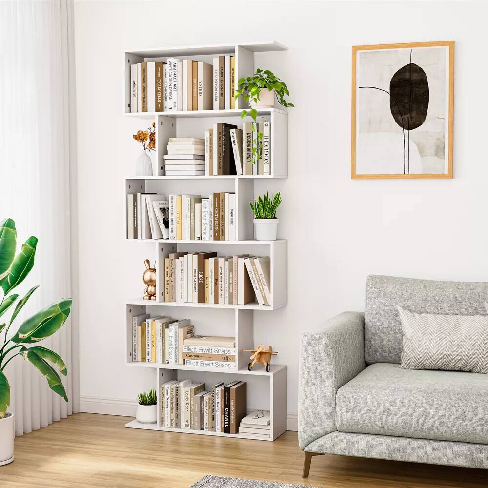 The text in the image is not clear enough to be accurately transcribed. However, based on the visible elements, it appears to be a modern, minimalist room with a bookshelf, a couch, and a framed abstract art piece on the wall.