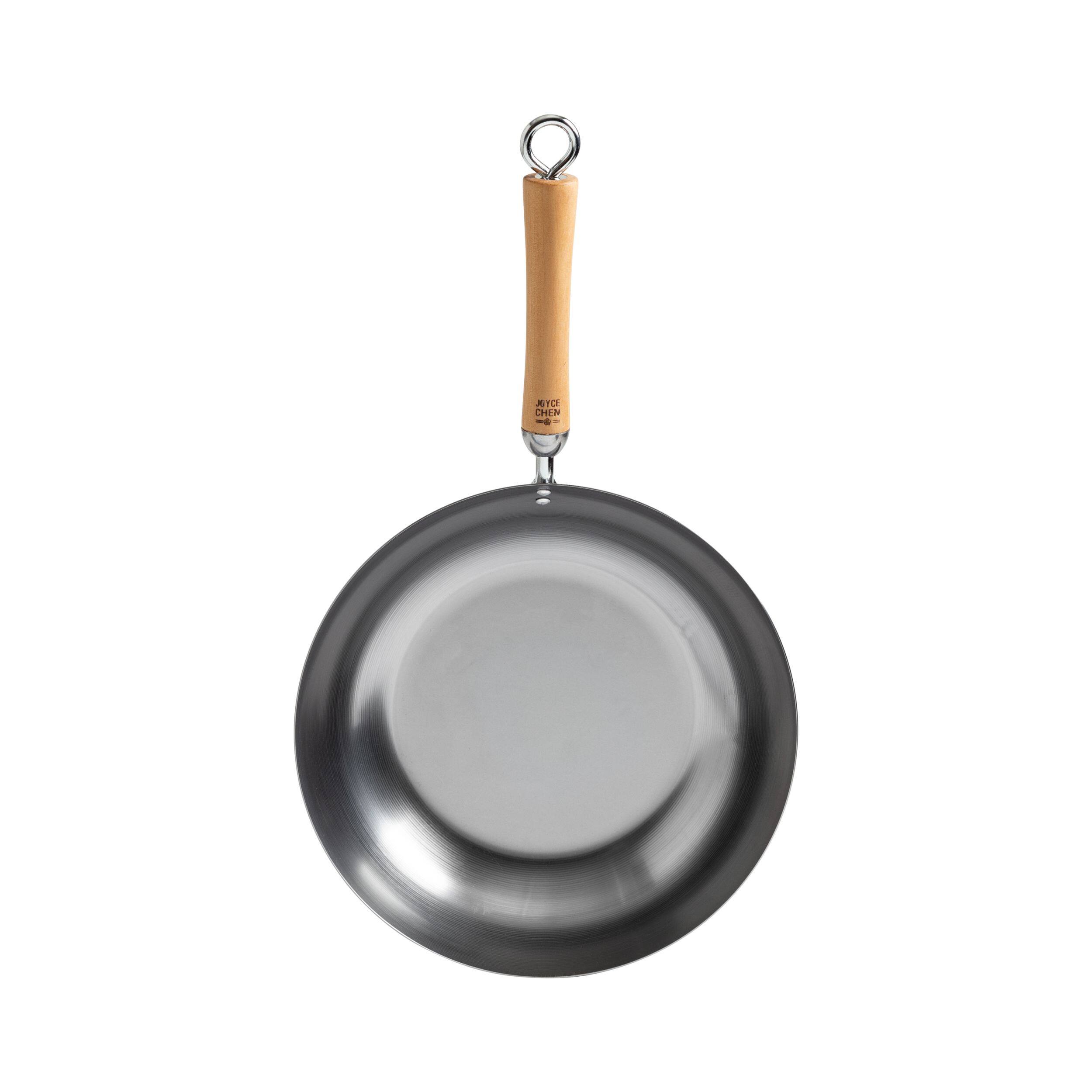 Angle. Escali - Joyce Chen Classic Series 12-Inch Uncoated Carbon Steel Stir Fry Pan with Birch Handle - Silver.