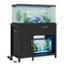 The image shows a black cabinet with a fish tank on top of it. The fish tank is filled with water and has several fish swimming around inside. The cabinet also has a drawer underneath the fish tank, which is currently empty. The fish tank is illuminated by blue lights, creating a visually appealing display. The cabinet is placed on a stand, making it a functional and attractive piece of furniture for the room.