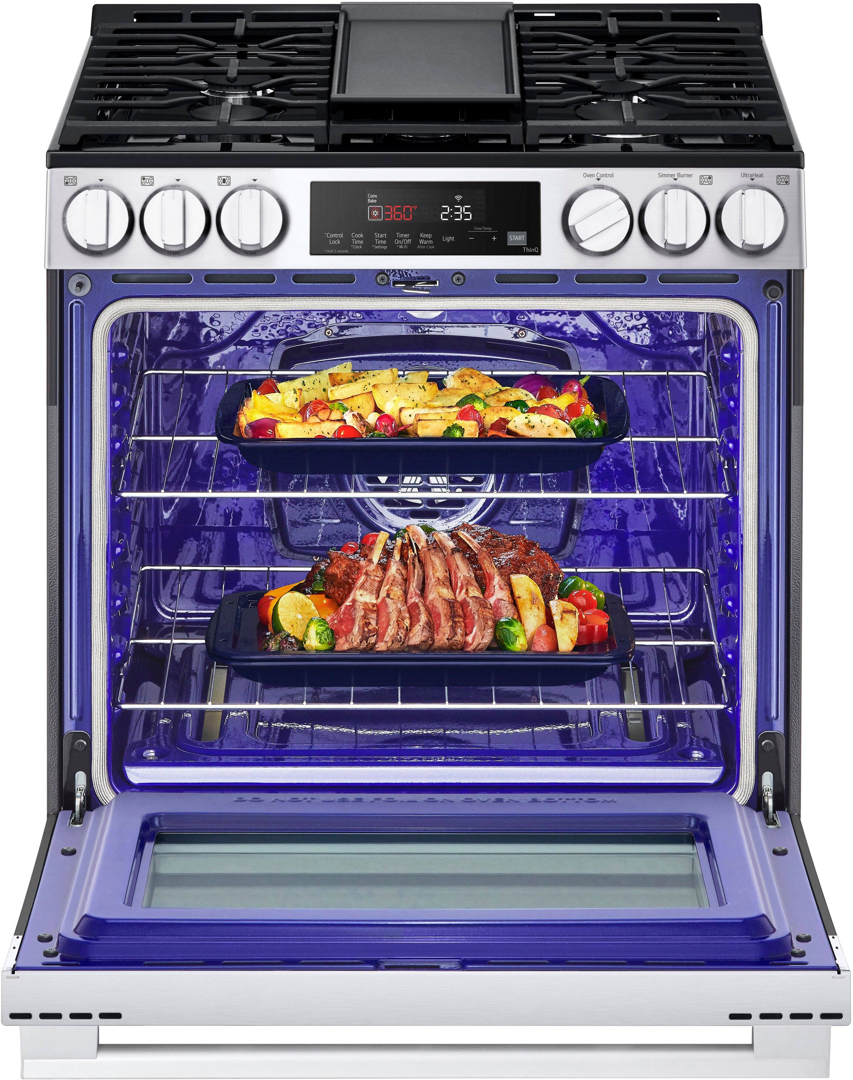 The text on the image reads: "1 as 1 - 360 2:35 Cantos A Core To - See UO - - : Ae SAR Thun." This text is not related to the image of the oven with food inside. The oven is a stove top oven with two trays of food cooking inside.