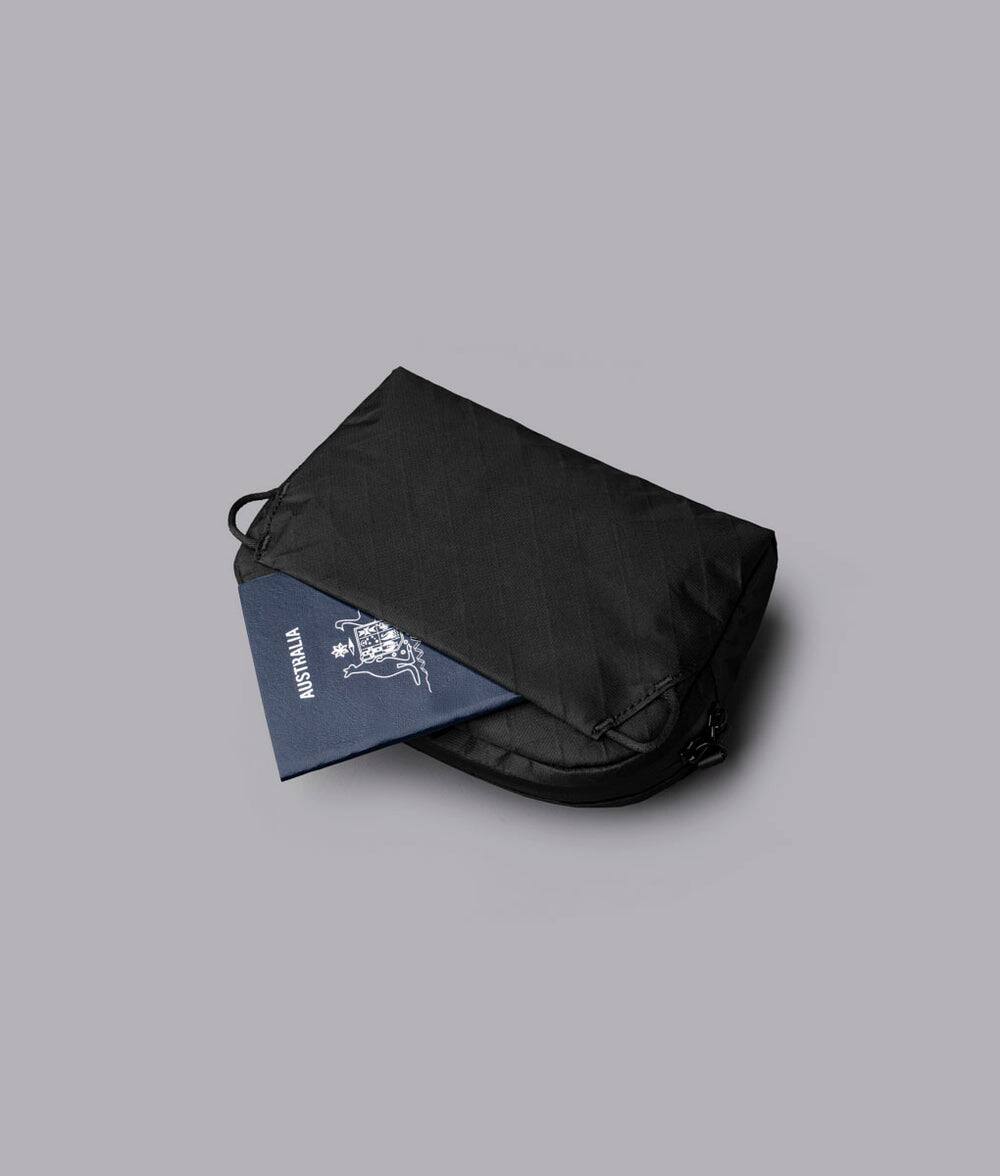 Back. ALPAKA - Flight Sling 1L Travel Sling Bag, Lightweight Crossbody Pouch, Phone Sleeve, Passport Pocket, Detachable Strap - Black Ultradyne 100D.