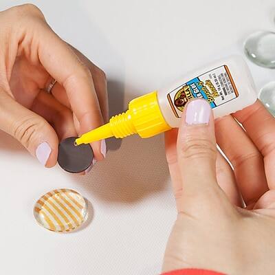 The text on the image reads:

"ILLA GLUE
Brush Nozzle E"