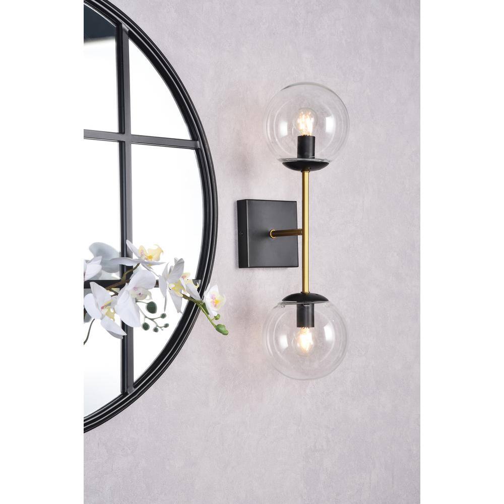 Left. Living District - Neri 2 lights black and brass and clear glass wall sconce - Black And Brass And Clear.