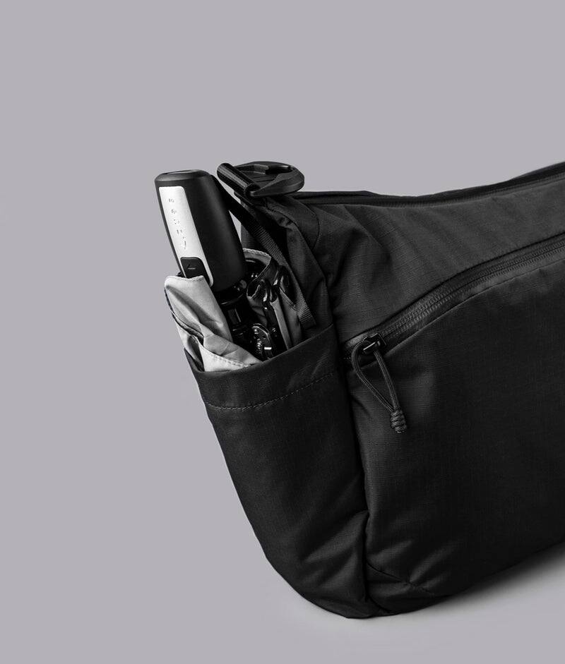 Alt View 5. ALPAKA - Laptop Messenger Satchel Bag 11L for Work & Travel, Fits 13" MacBook Air, Bottle Pockets, Luggage Pass-Through - Black Axoflux 210D.