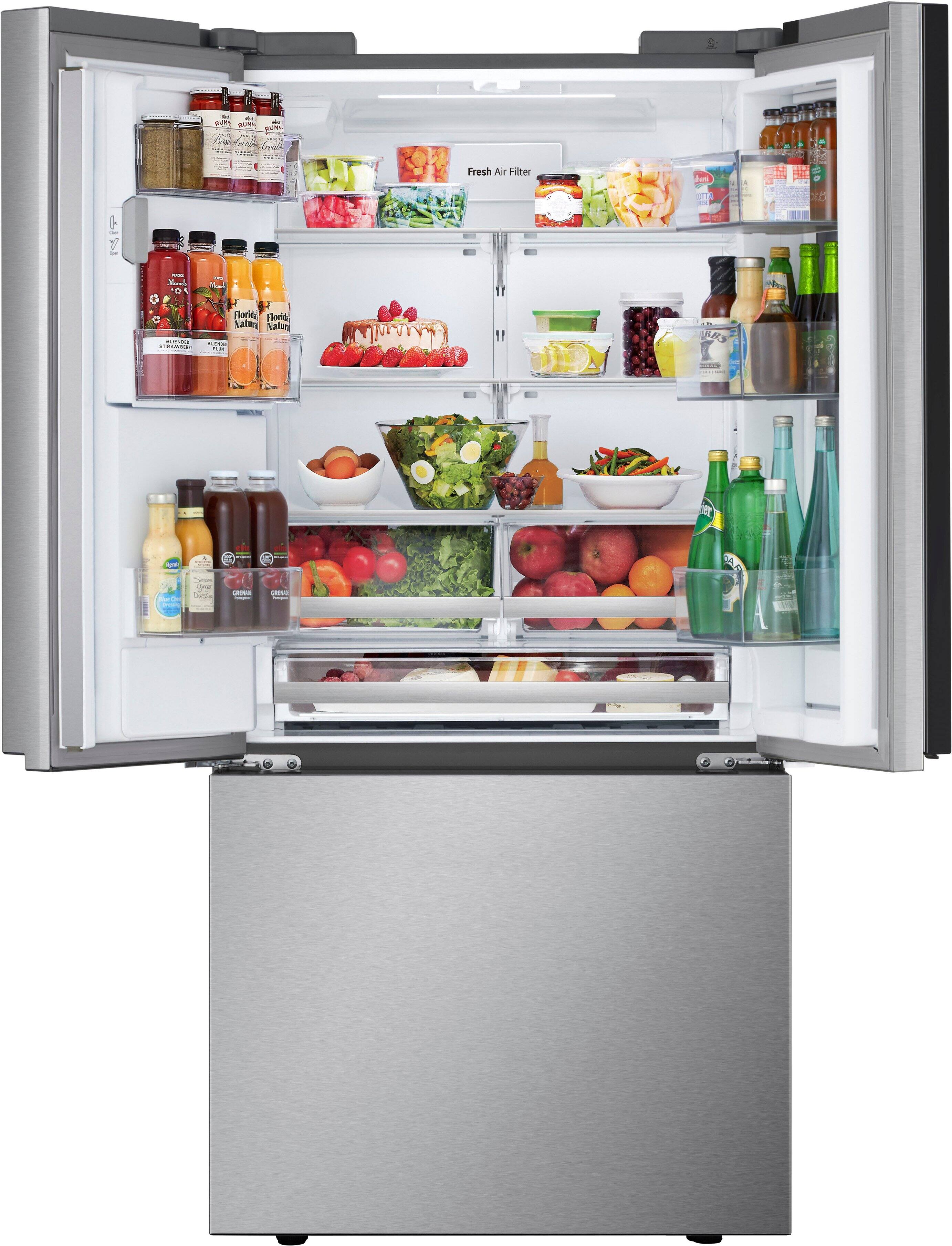 The refrigerator is filled with various food items, including fruits and vegetables. There are multiple bottles of juice, milk, and soda, as well as a bowl of fruit. The refrigerator is also stocked with a variety of drinks, such as water and soda. The refrigerator is organized, making it easy to find and access the desired items.